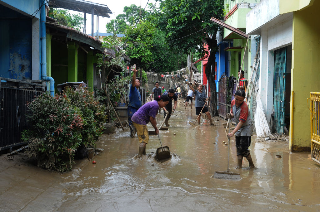 Residents began cleaning mud and furniture affected by floods as high as 5 meters in the residential Pondok gede permai, Bekasi, West Java, Jan. 4,2020. (Dasril Roszandi—NurPhoto/Getty Images)