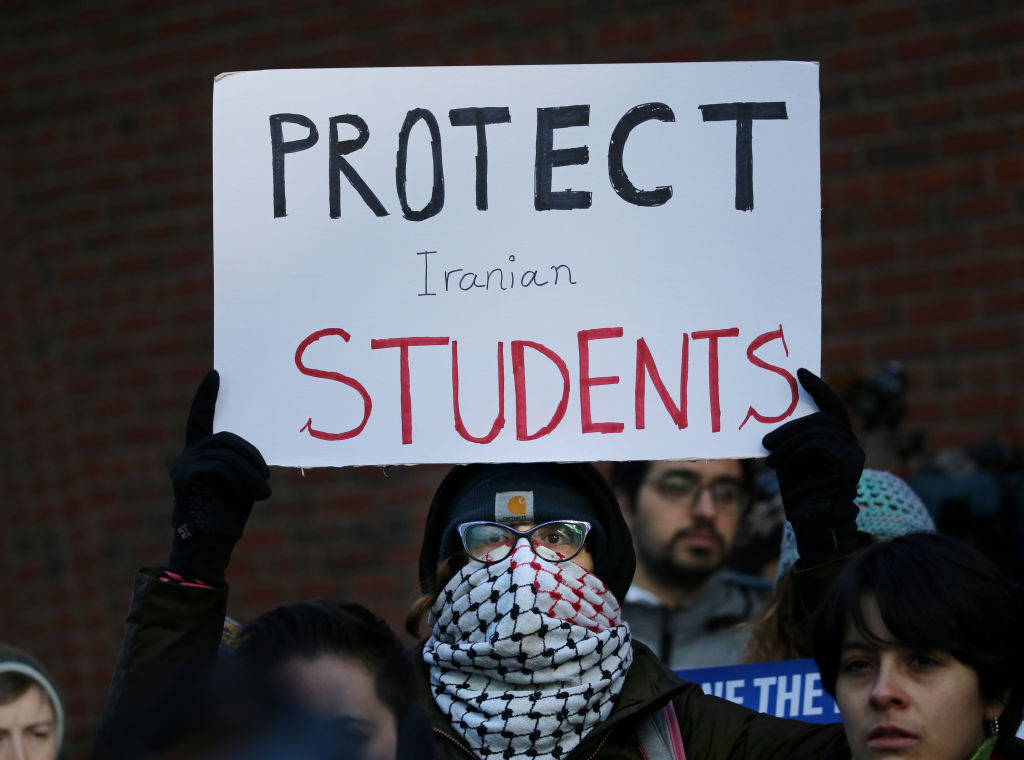 Cassidy Taylor offers support to a deported Iranian student while protesting outside the federal courthouse in Boston, Mass., on Jan. 21, 2020. (Boston Globe via Getty Images&mdash;2020 - The Boston Globe)