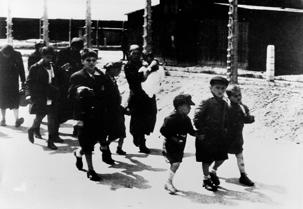 Auschwitz detainees walking to gas chambers. Many of the French Jews rounded up in Paris during the Vel D'Hiv deportation in July 1942 were sent to Auschwitz. (Antoine GYORI/Sygma—Getty Images)