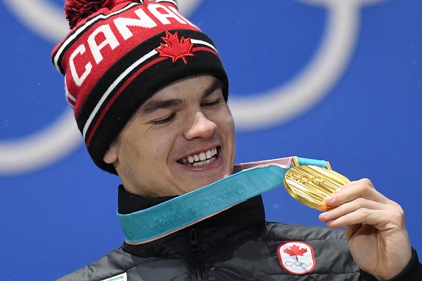 Canada's gold medallist Mikael Kingsbury poses on the podium during the medal ceremony for the freestyle skiing men's moguls at the PyeongChang Medals Plaza during the PyeongChang 2018 Winter Olympic Games in PyeongChang on February 13, 2018.