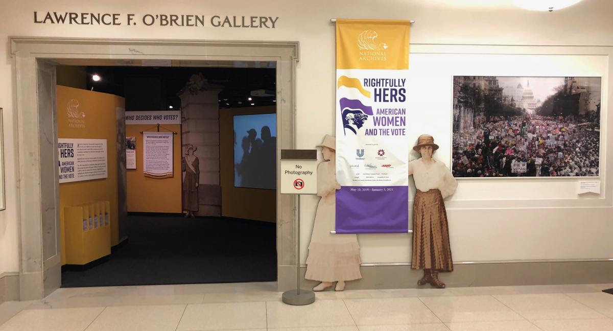 Images from the 1913 and 2017 Women's Marches were displayed as a promotional graphic in the elevator lobby outside the entrance to the "Rightfully Hers" exhibit at the National Archives in Washington, DC. The image was removed January 18, 2020 and will be replaced. (Courtesy National Archives. Photo by John Valceanu)