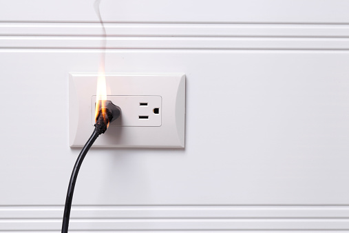 Electric plug on fire