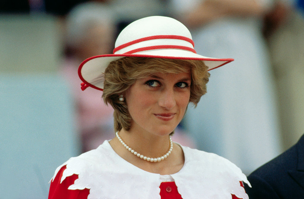 Diana, Princess of Wales, wears an outfit in the colors of Canada during a state visit to Edmonton, Alberta, with her husband. (Bettmann Archive)