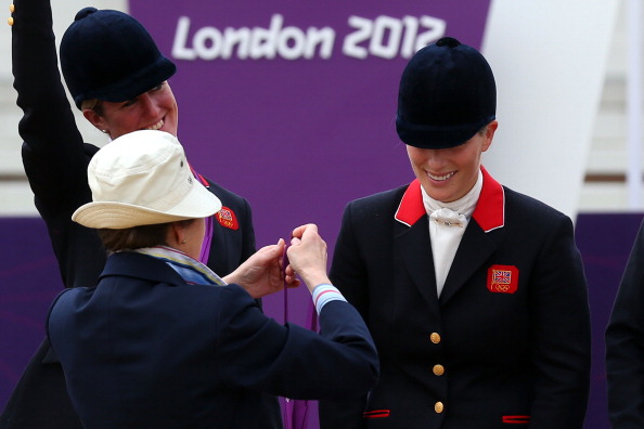 Zara Phillips is presented a silver medal by her mother, Princess Anne, after the Eventing Team Jumping Final Equestrian event on Day 4 of the London 2012 Olympic Games at Greenwich Park in London, England on July 31, 2012.