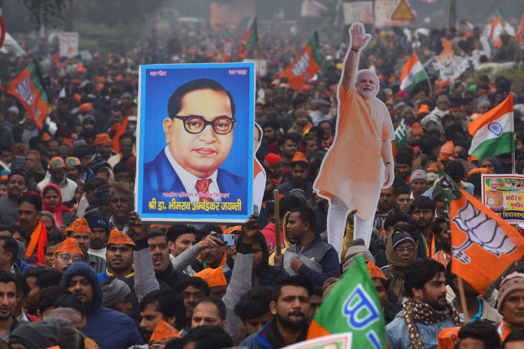 A BJP supporter holds up an image of B.R Ambedkar during a rally for Indian Prime Minister Narendra Modi on December 22, 2019 in New Delhi, India. (Sanchit Khanna/Hindustan Times via Getty Images—2019 Hindustan Times)