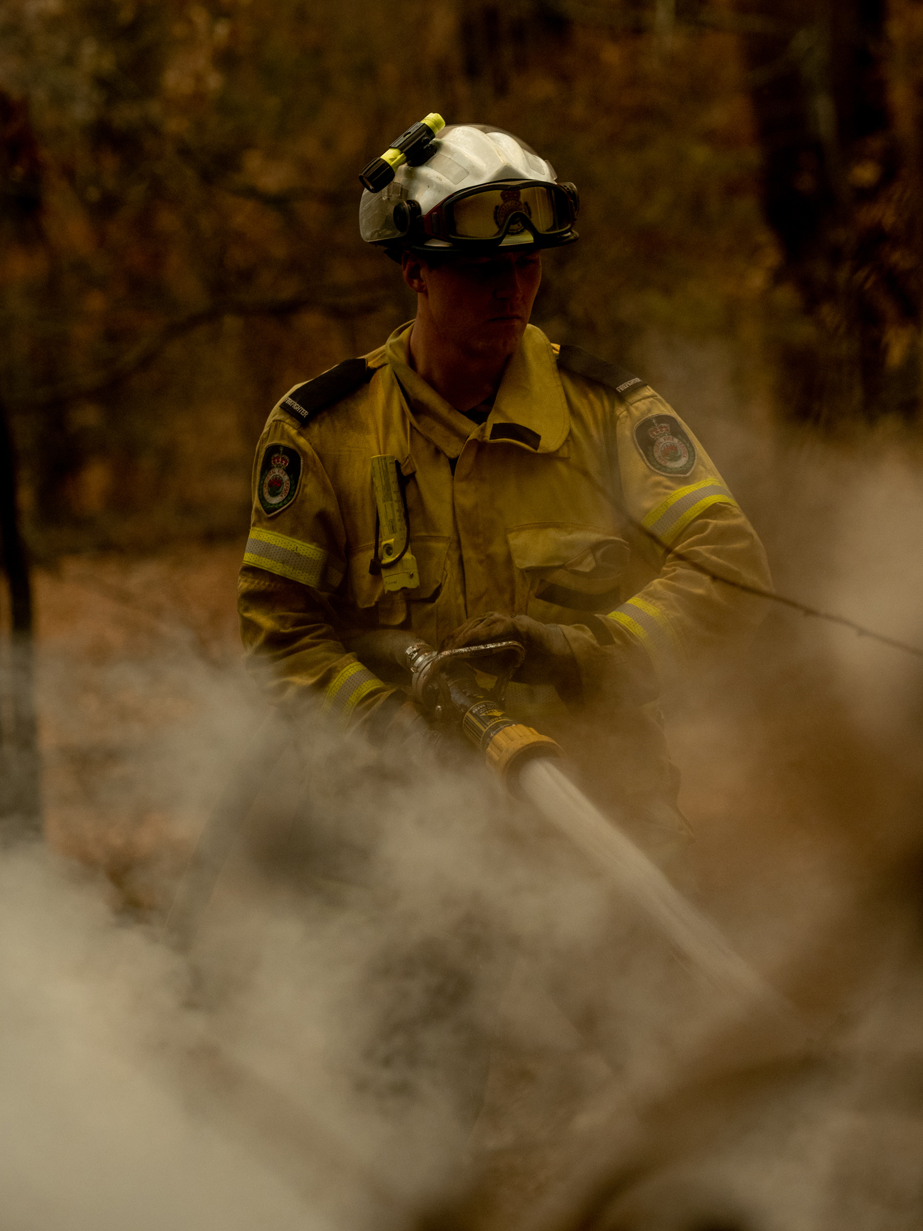 A New South Wales Rural Fire Service (RFS) member fights a fire in Lake Innes, Australia on Dec. 6, 2019. (Michaela Skovranova)
