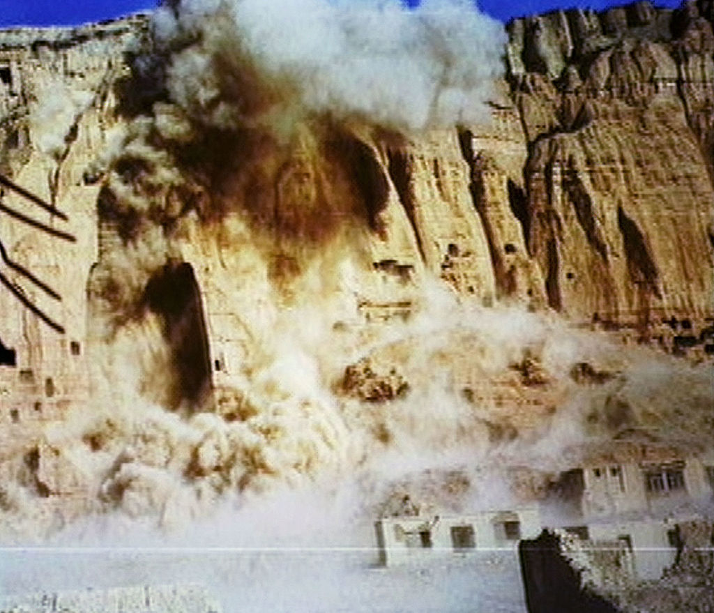 The giant Buddhas of Bamiyan are destroyed by the Taliban government on March 12, 2001 in Bamiyan, Afghanistan. The two enormous statues, measuring 175 feet in height, were carved into sandstone cliffs at Bamiyan by Buddhist worshippers who traveled the Silk Road from China in the third century A.D. (CNN via Getty Images)