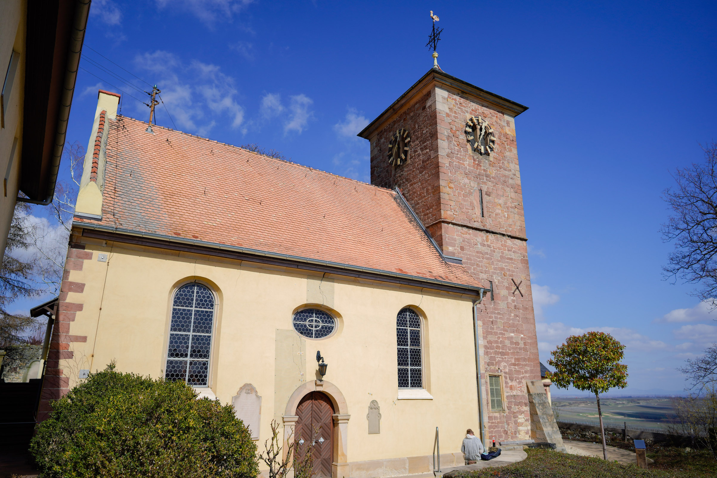 The Protestant Church in Herxheim am Berg, in front of which an information board had recently been erected, on March 19, 2019. The plaque explains how the bell with the inscription "Everything for the Fatherland. Adolf Hitler" had entered the church and that it would remain there as a reminder for the future. (Uwe Anspach/dpa via Getty Image)