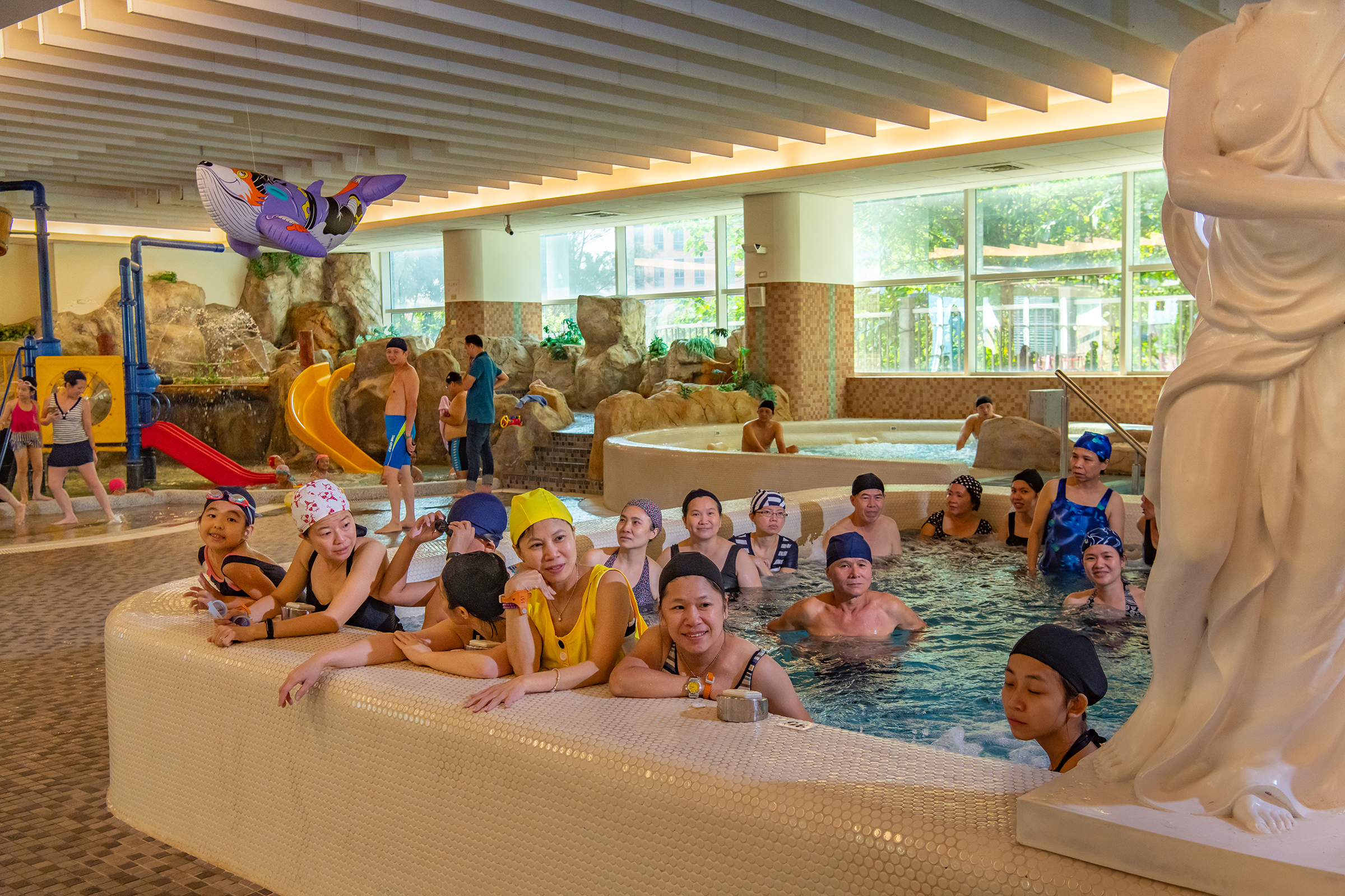 Supporters at a swimming pool wait for the President's arrival during a visit on Oct. 5.