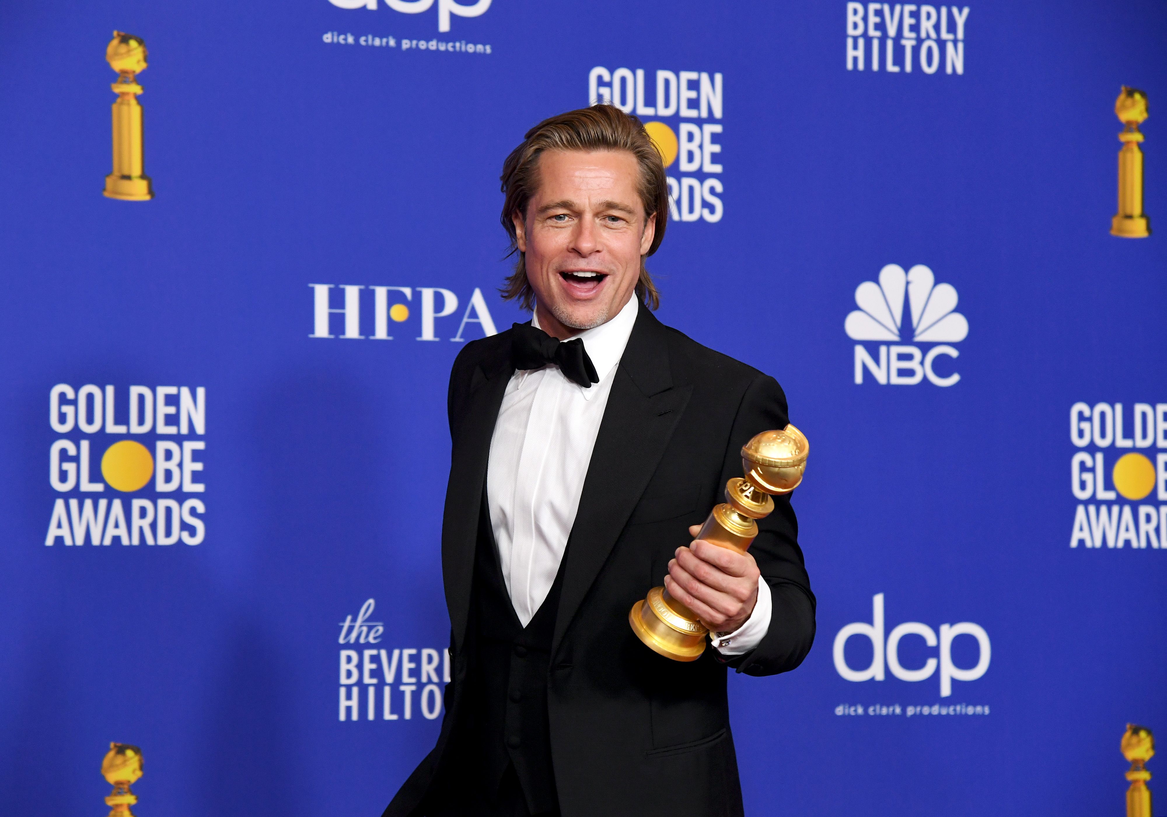 Brad Pitt, winner of Best Performance by a Supporting Actor in a Motion Picture, poses in the press room during the 77th Annual Golden Globe Awards. (Kevin Winter—Getty Images)