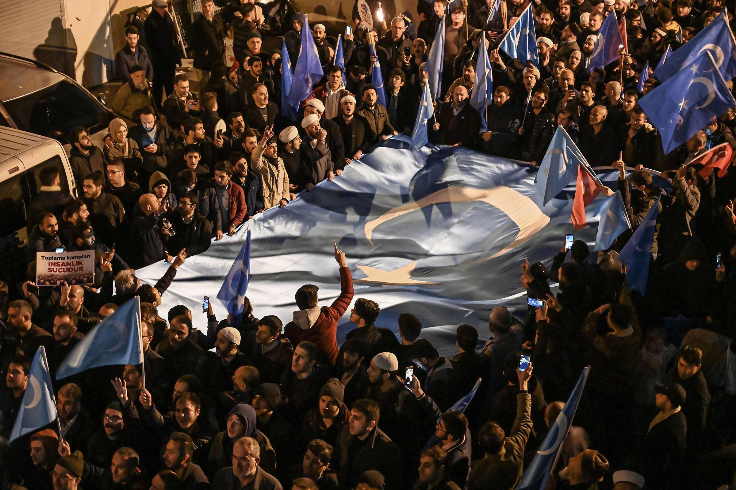 Supporters of China's Muslim Uighur minority march with flags of East Turkestan during a demonstration in Istanbul on Dec. 20, 2019. (Ozan Kose—AFP/Getty Images)