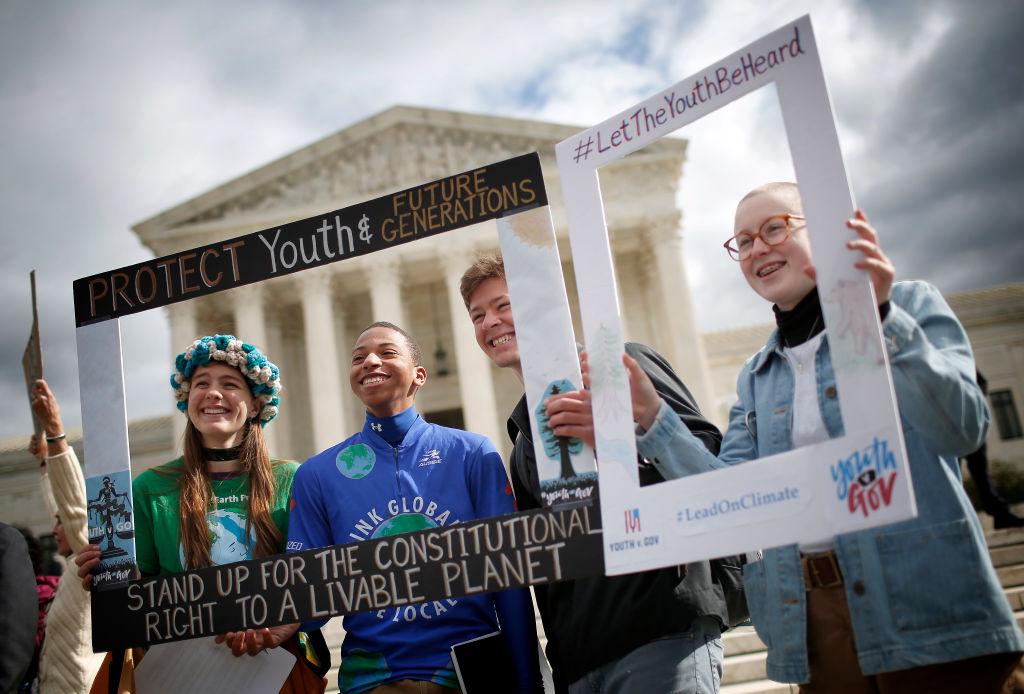Protesters attend a rally outside the U.S. Supreme Court held by the group Our Children’s Trust October 29, 2018 in Washington, DC. The group rallied in support of the Juliana v. U.S. lawsuit brought on behalf of 21 youth plaintiffs that argues the U.S. government has violated constitutional rights for more than 50 years by contributing to climate change. (Win McNamee—Getty Images)