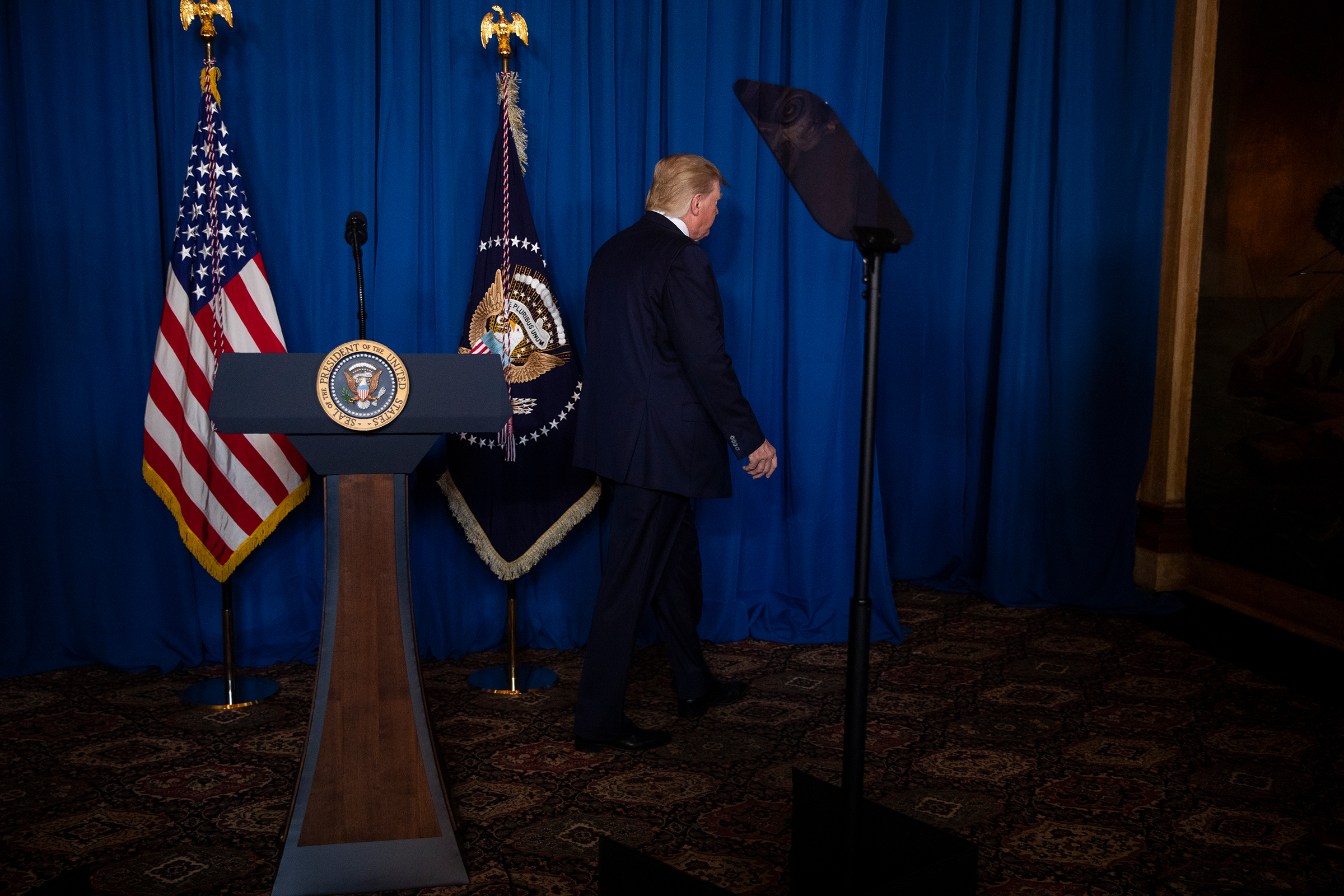 President Trump walks off after delivering remarks on Iran at his Mar-a-Lago property in Palm Beach, Fla., on Jan. 3, 2020. (Evan Vucci—AP)