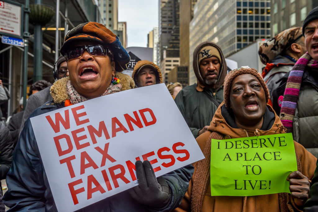 Hundreds rally outside Governor Andrew Cuomo's NYC Office to support the Albany Can End Homelessness in New York State campaign, about ten faith and community leaders committed civil disobedience blocking third avenue with banners reading 