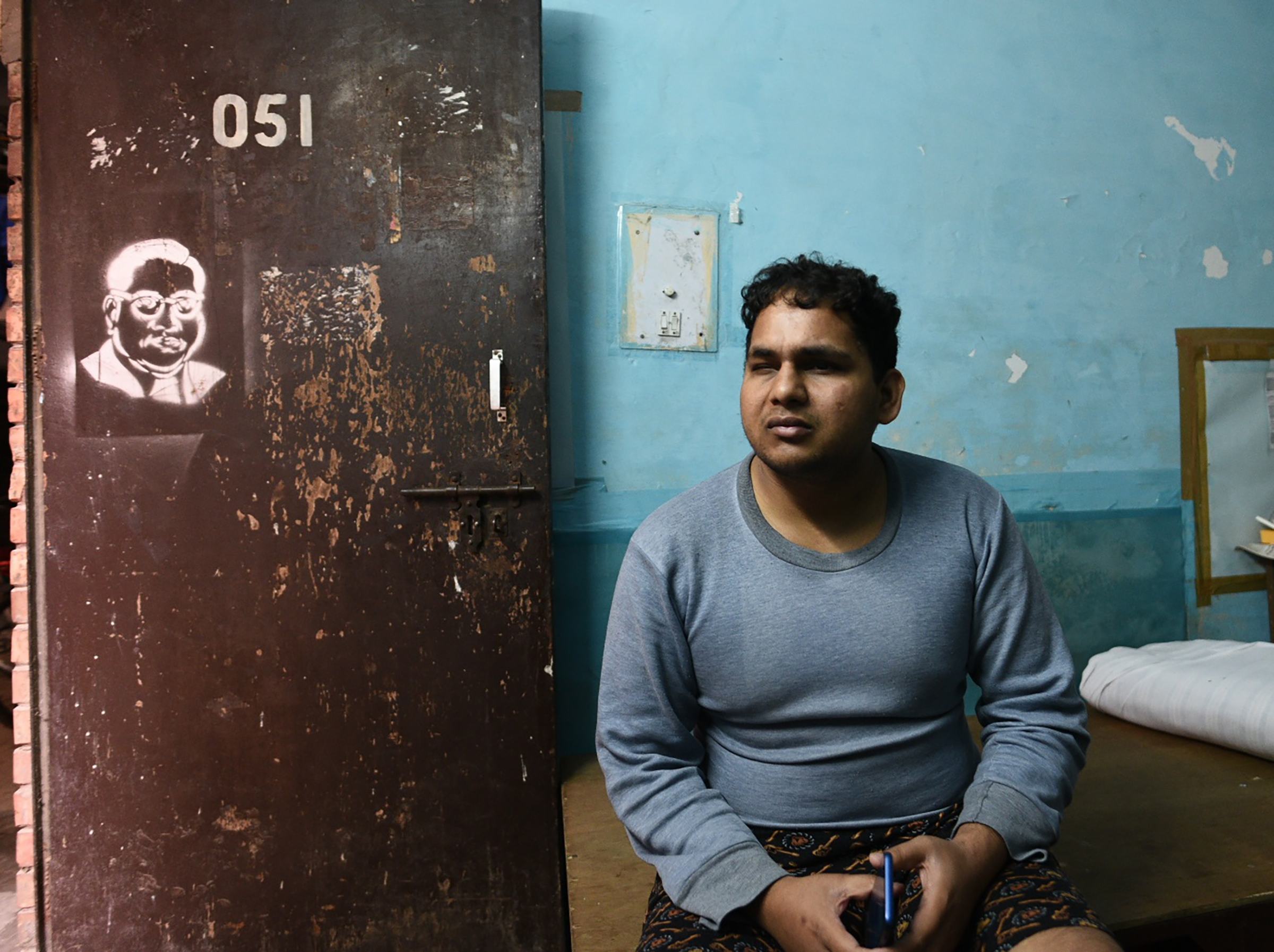Suryaprakash, a blind research scholar pursuing an MPhil in Sanskrit, is seen sitting in his room at Sabarmati Hostel, Jawaharlal Nehru University (JNU), on Jan. 6, 2020 in New Delhi, India. He was also beaten up the day before during violence inside the campus. (Vipin Kumar—Hindustan Times via Getty Images)