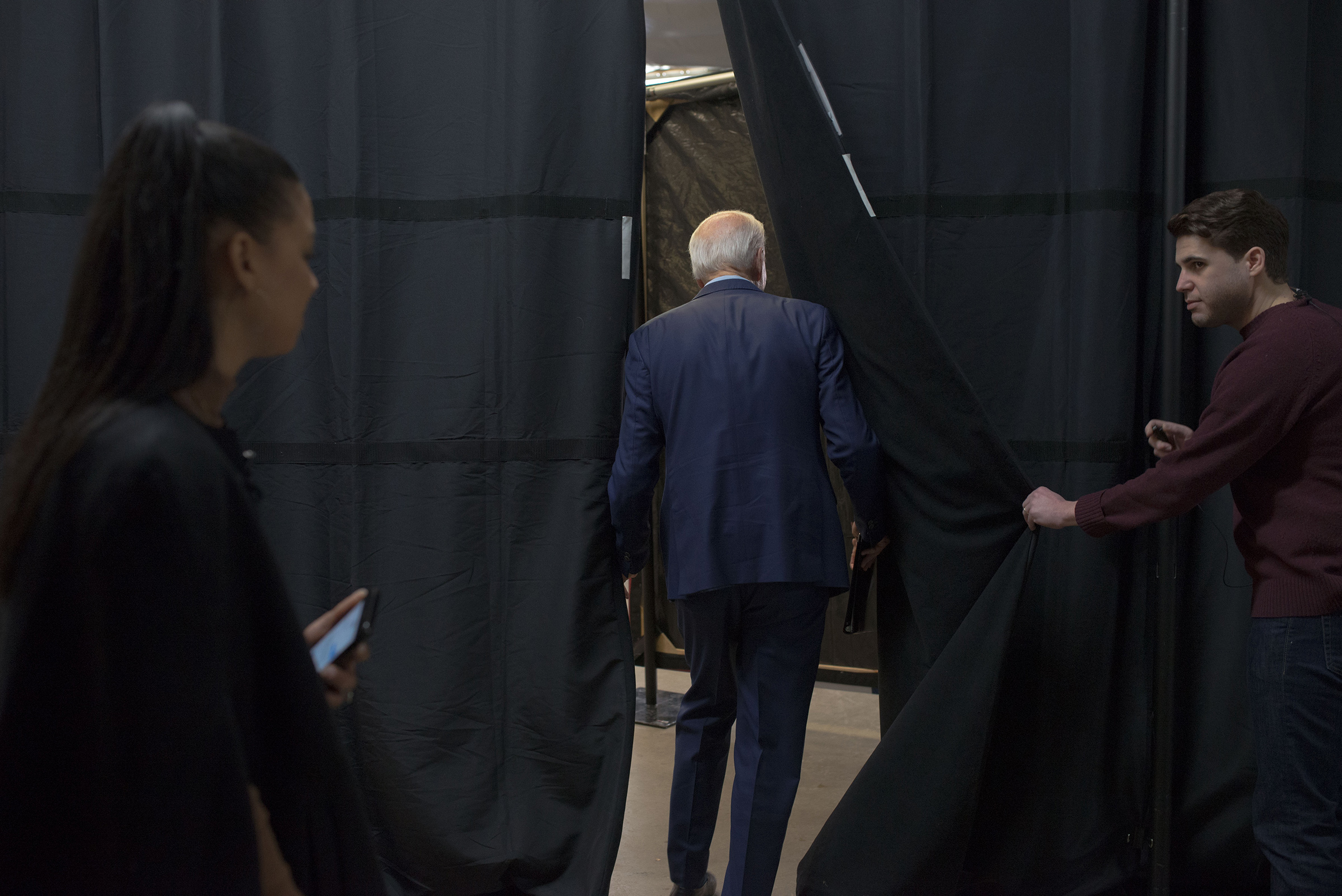 Biden waits backstage before his campaign event in Mason City (September Dawn Bottoms for TIME)