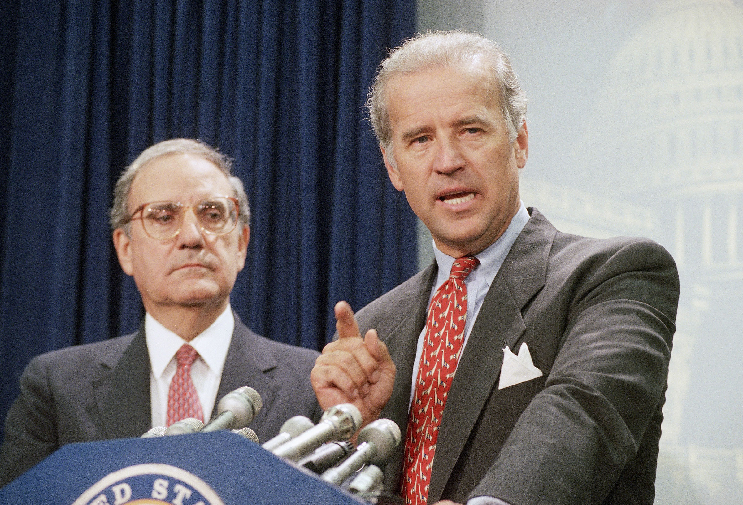 Biden helps write the controversial crime bill signed by President Clinton in 1994 (AP)