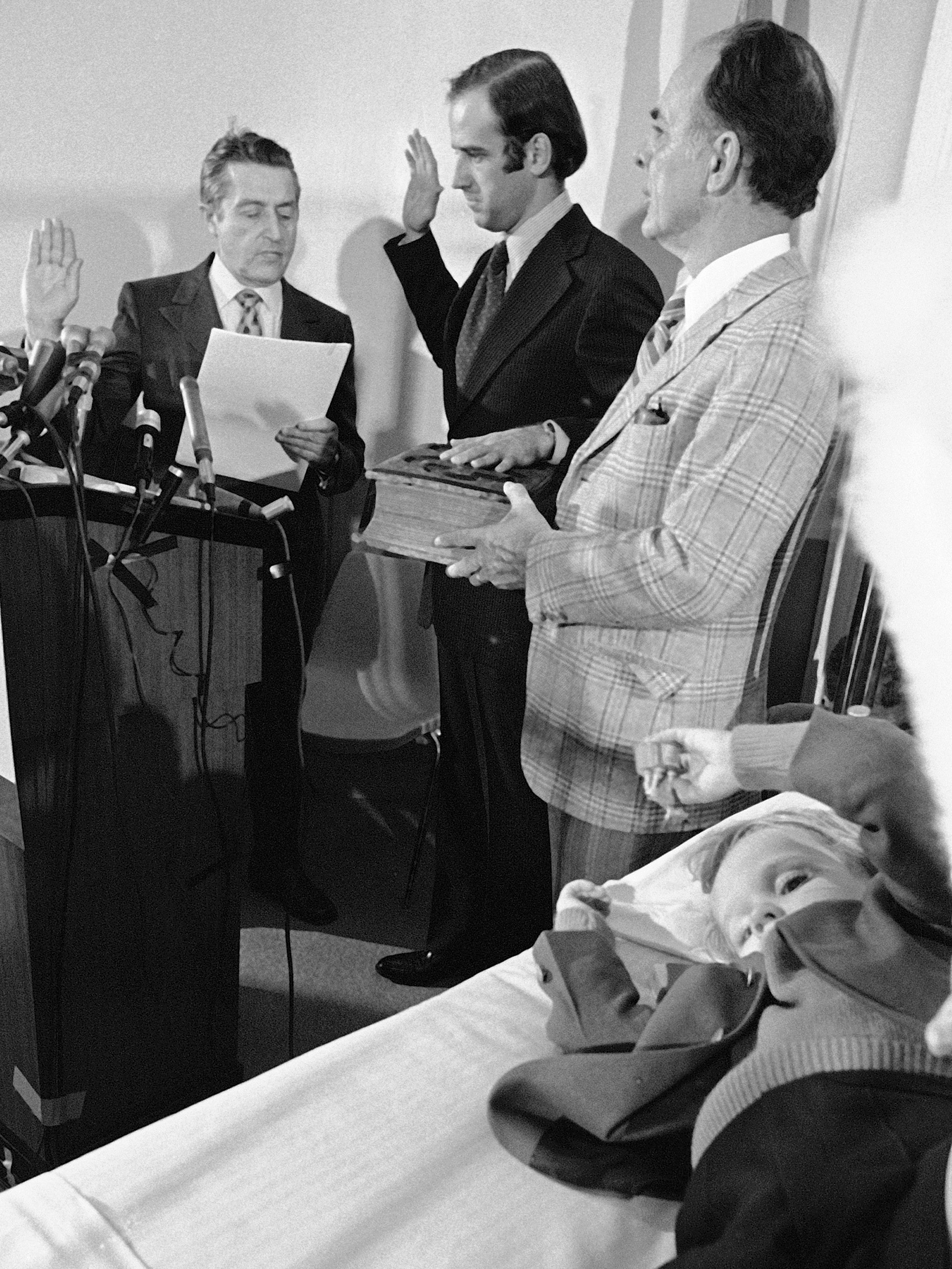 Mourning his wife and daughter, Biden is sworn in at his sons’ hospital room in 1973 (AP)
