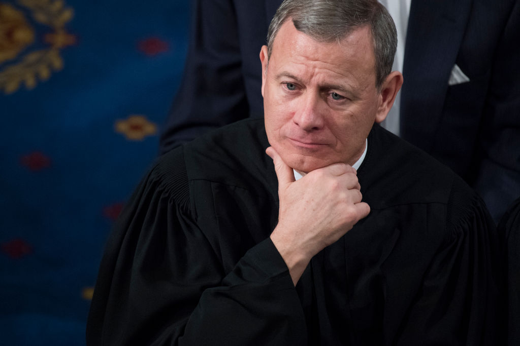 Supreme Court Chief Justice John Roberts listens to President Donald Trump's State of the Union address to a joint session of Congress on January 30, 2018. (Tom Williams—CQ Roll Call/Getty Images)