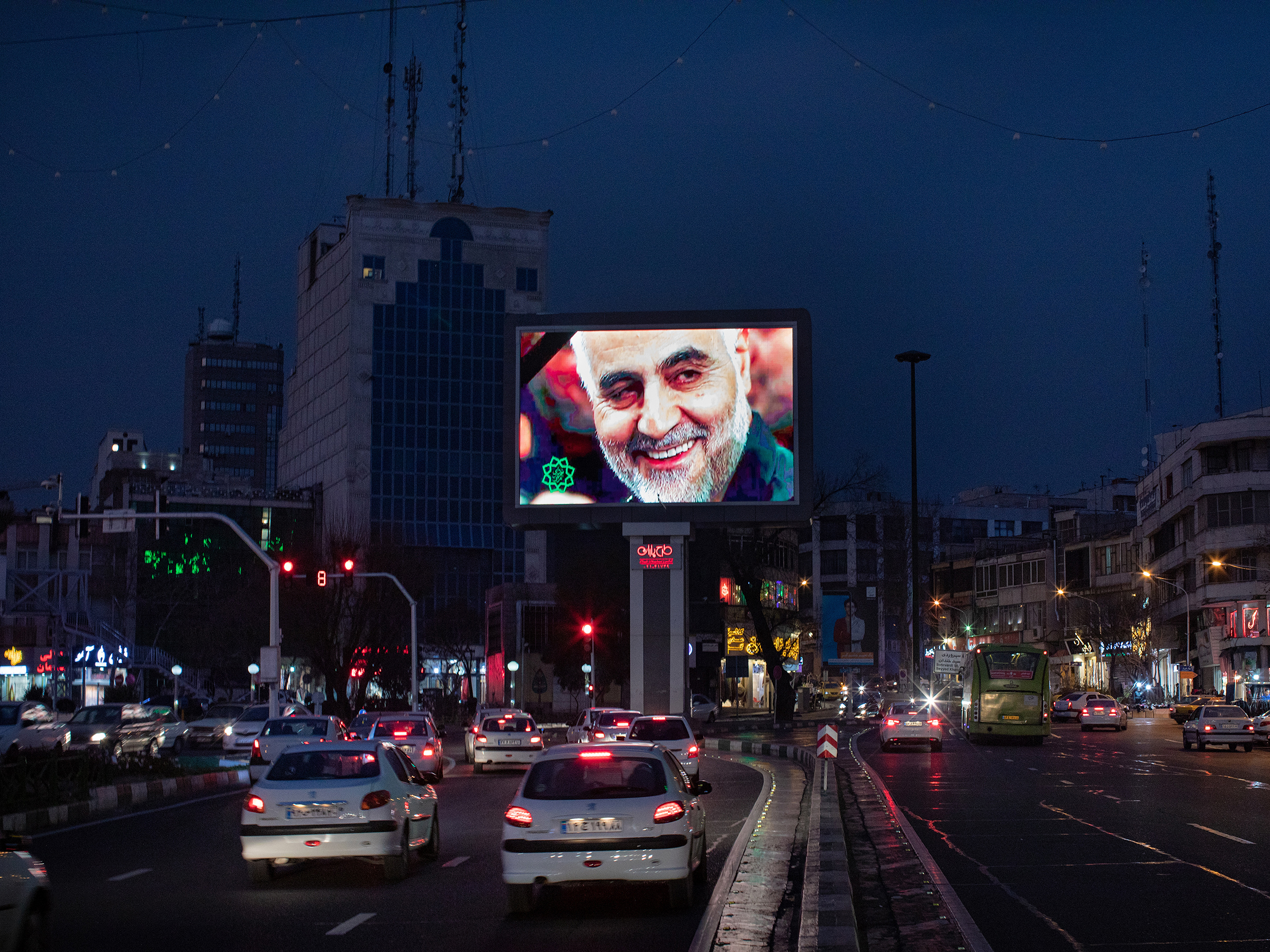 As the evening traffic unfolds in Tehran, a giant digital billboard in Haft-e Tir square displays an image of Maj. Gen. Qasem Soleimani, following his killing in Baghdad, on Jan. 3.