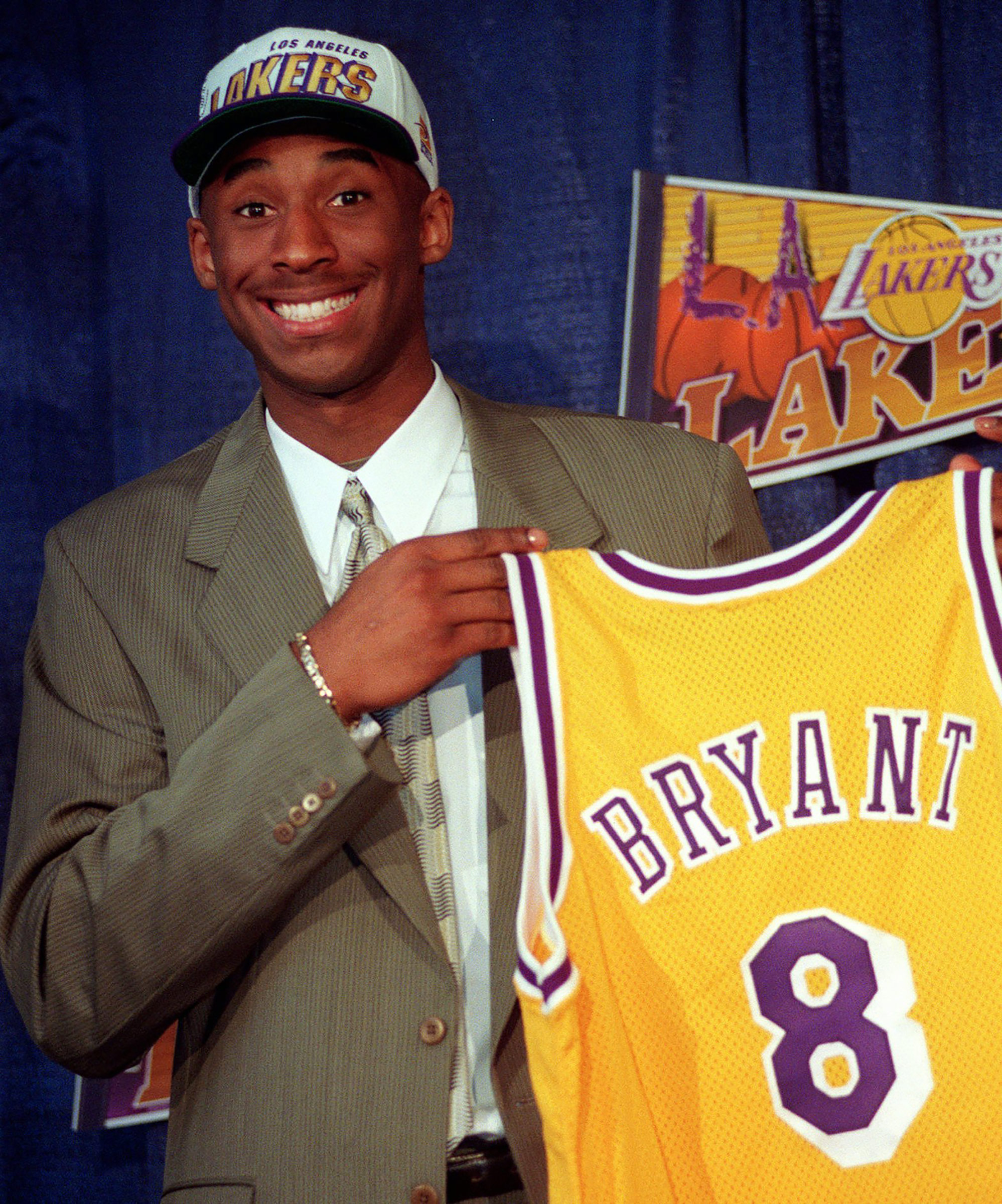 Kobe Bryant, 17, holds his Los Angeles Lakers jersey