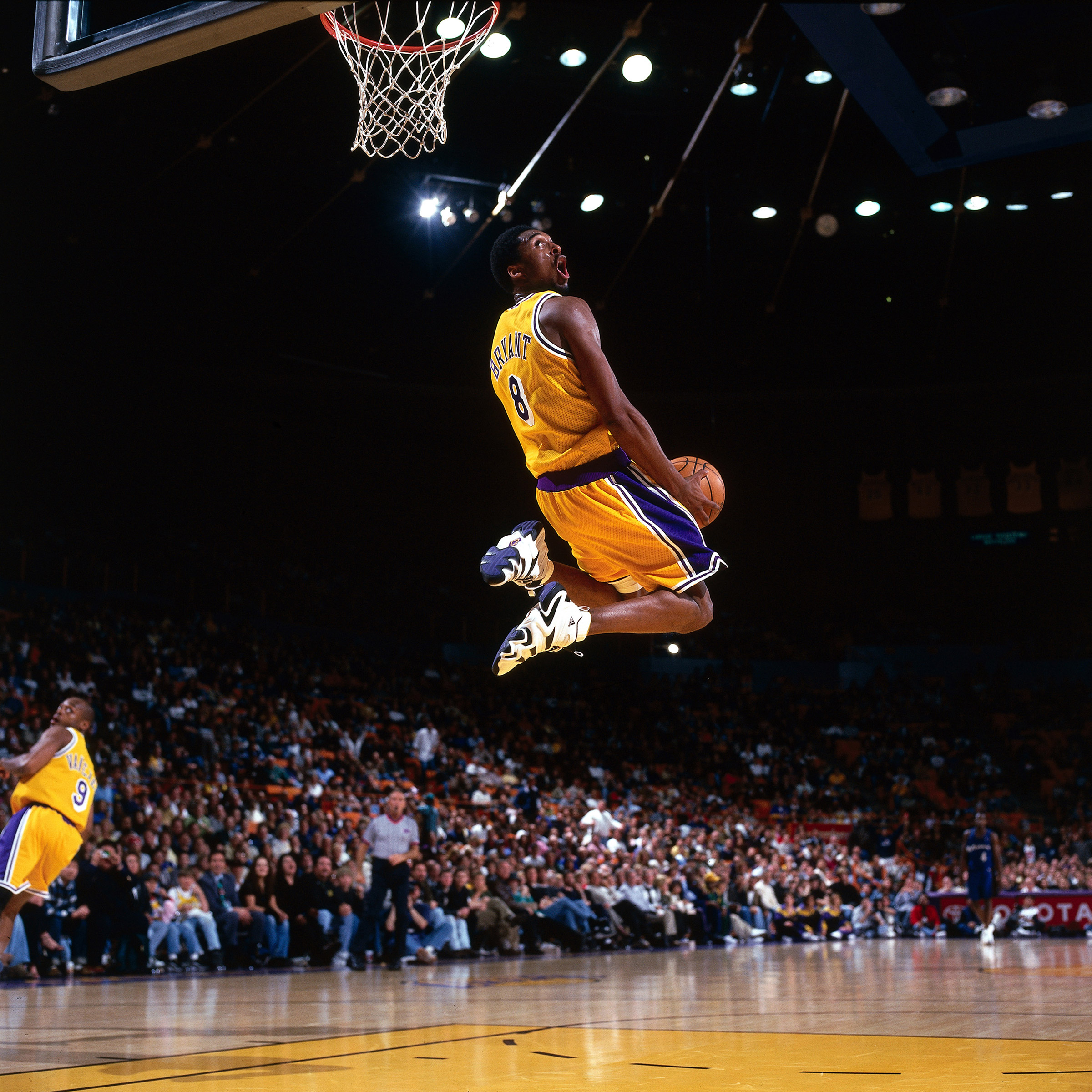 Bryant’s aerial displays were among the game’s most thrilling ever; here, a reverse slam in a 1998 home game