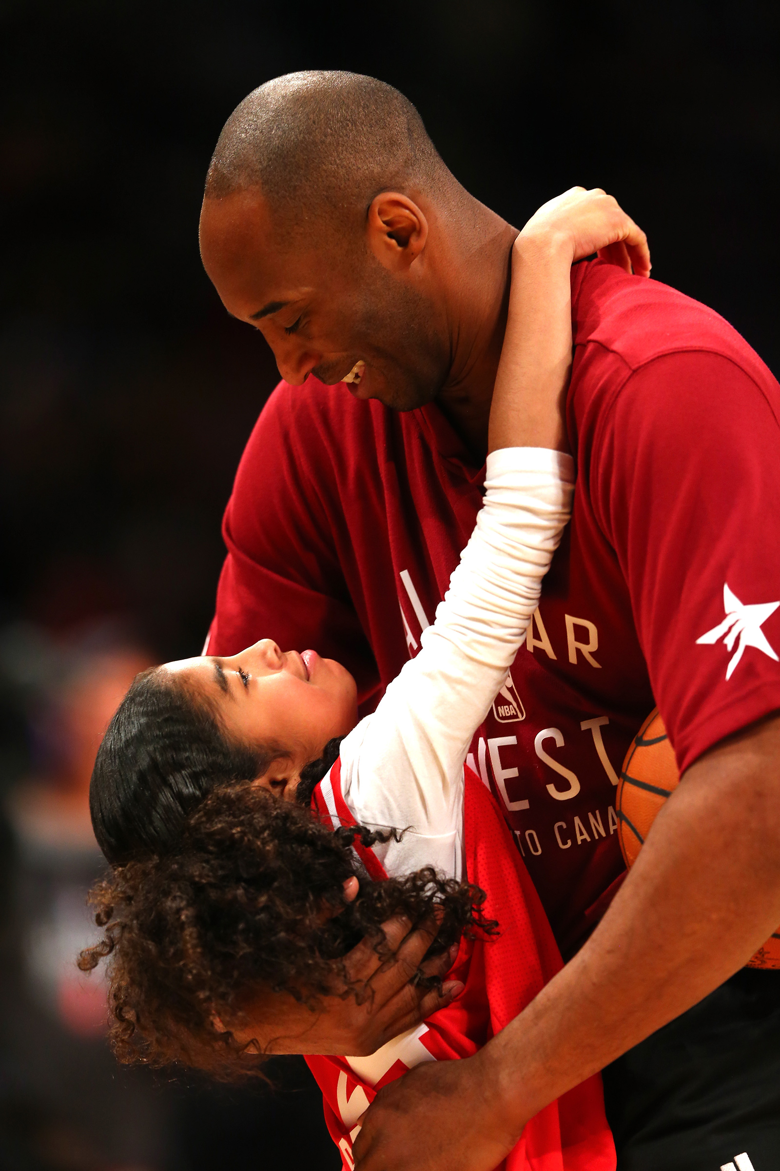 Bryant holds his daughter Gianna, then 9, before the 2016 NBA All-Star Game in Toronto