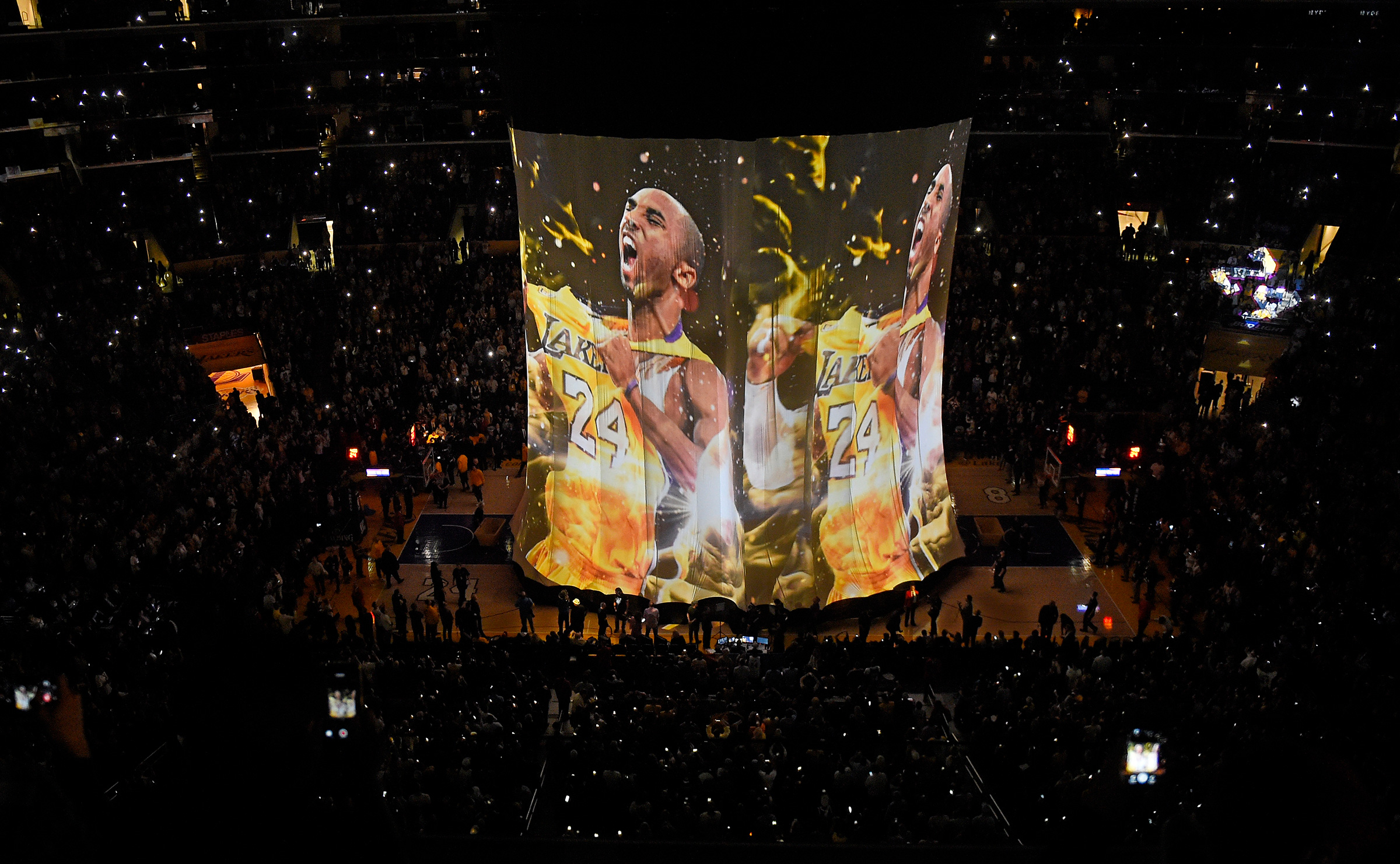 Los Angeles Lakers forward Kobe Bryant's image is displayed to the crowd during a ceremony before Bryant's last game on April 13, 2016. (Mark J. Terrill—AP)