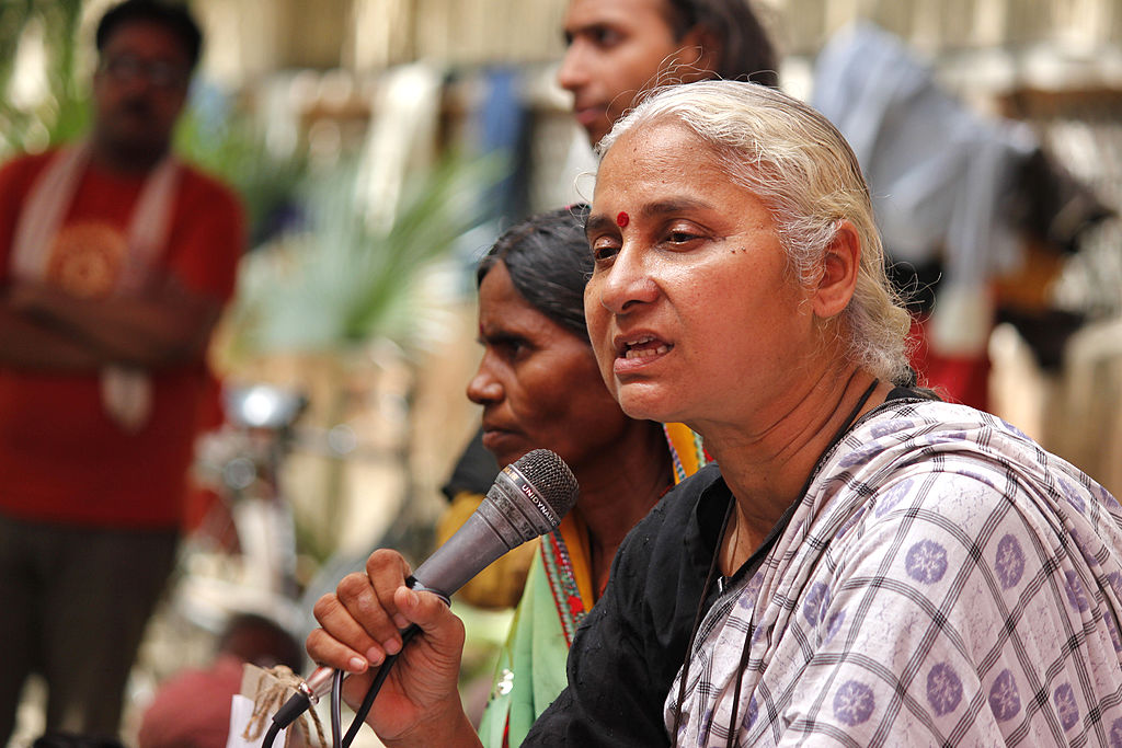 Activist Medha Patekar and supporters of Narmada Bachao Andolan staging a protest against raising height of Narmada dam at Jantar Mantar on June 25, 2014 in New Delhi, India. (Virendra Singh Gosain/Hindustan Times via Getty Images)