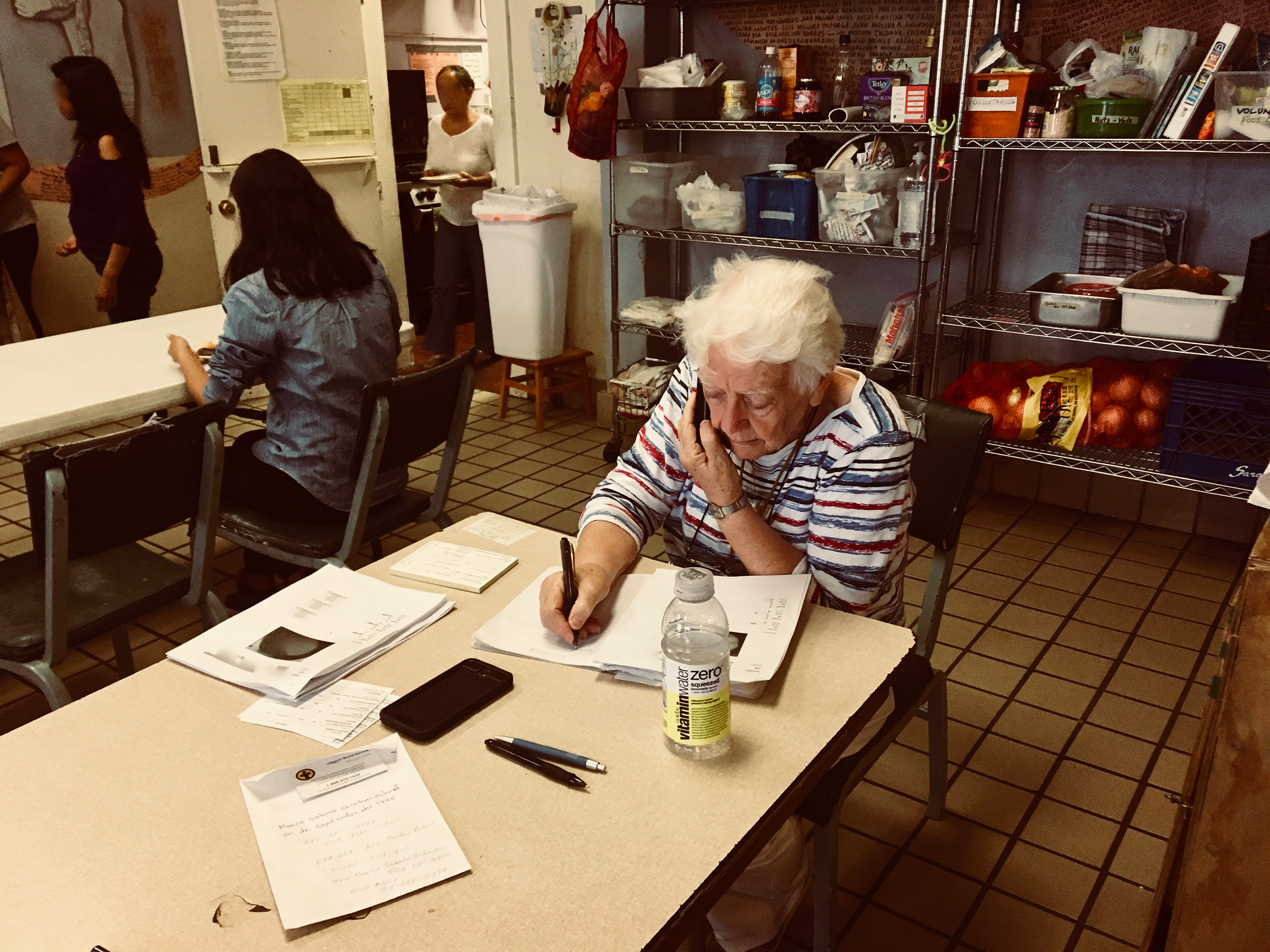 Sister Caroline Sweeney, a volunteer, makes calls to the families of recent arrivals in Casa Vides in El Paso, Texas in August 2019. (Courtesy of Lily Moore-Eissenberg)