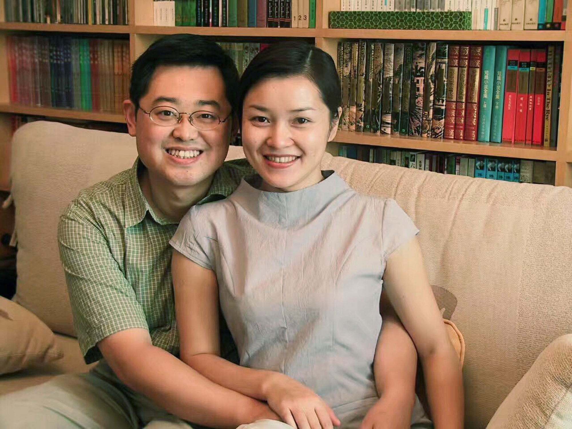 In this 2000 photo provided by ChinaAid, pastor Wang Yi, left, poses with his wife Jiang Rong at the study room of their home in Chengdu, China. (ChinaAid/AP)
