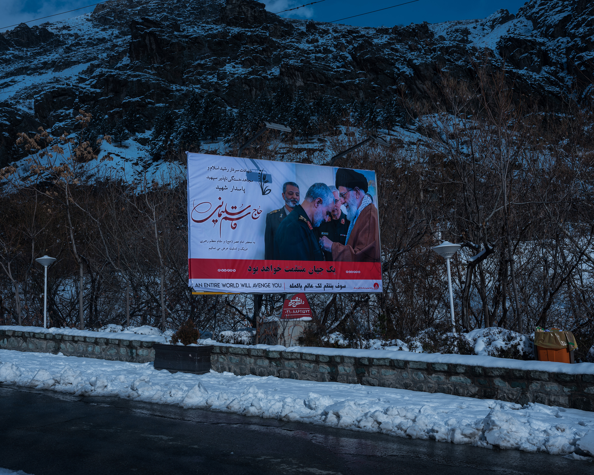 A poster showing Soleimani and the Supreme Leader, Ayatollah Ali Khamenei, in the snowy mountains above Iran’s capital. (Newsha Tavakolian—Magnum Photos for TIME)
