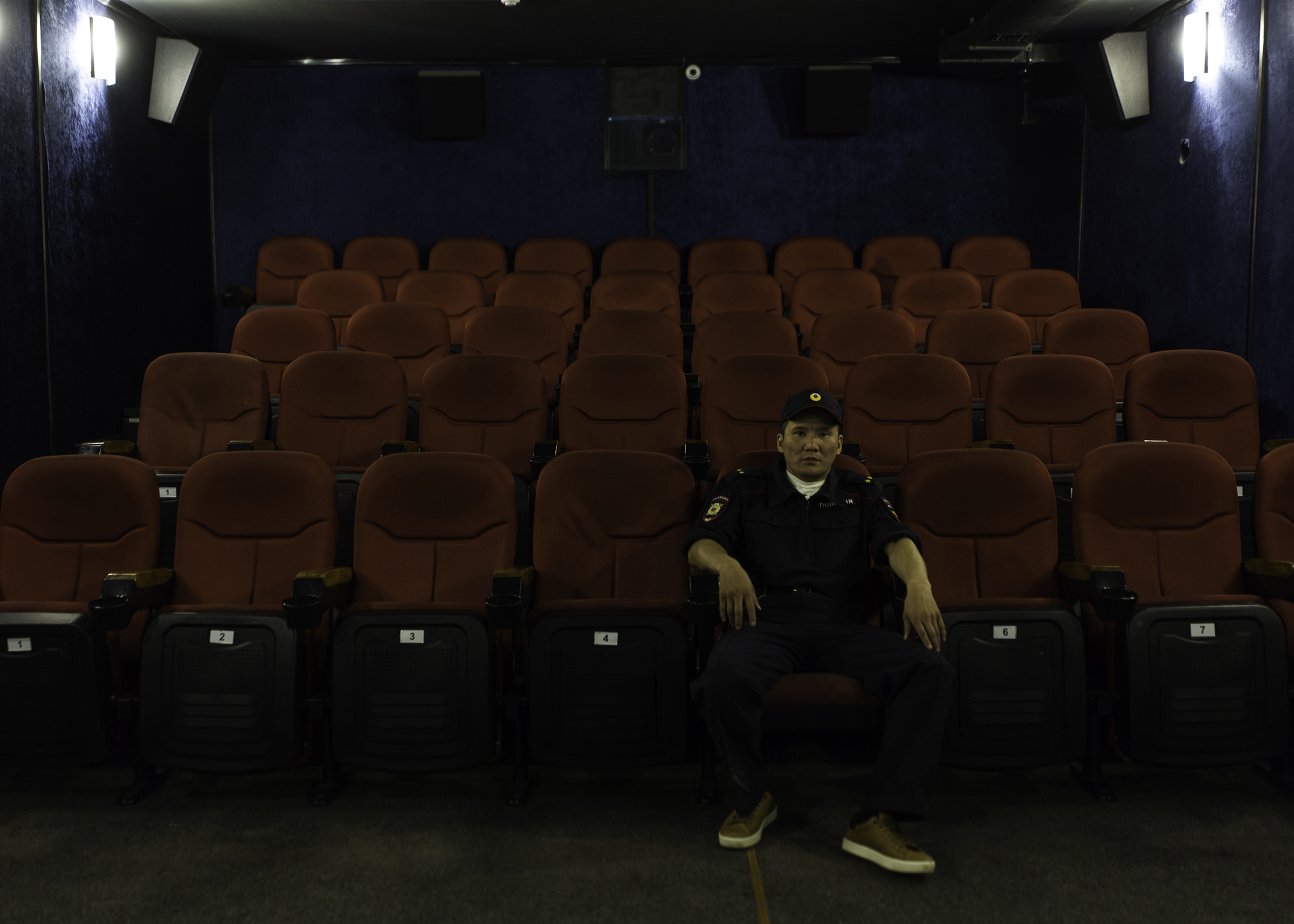 Theater actor Vladimir Okhlopkov, who played the role of a police officer in the horror film 'The Cursed Land' directed by Stepan Burnashev, poses in a small movie theater in Yakutsk, Yakutia in June 2019. (Alexey Vasilyev)