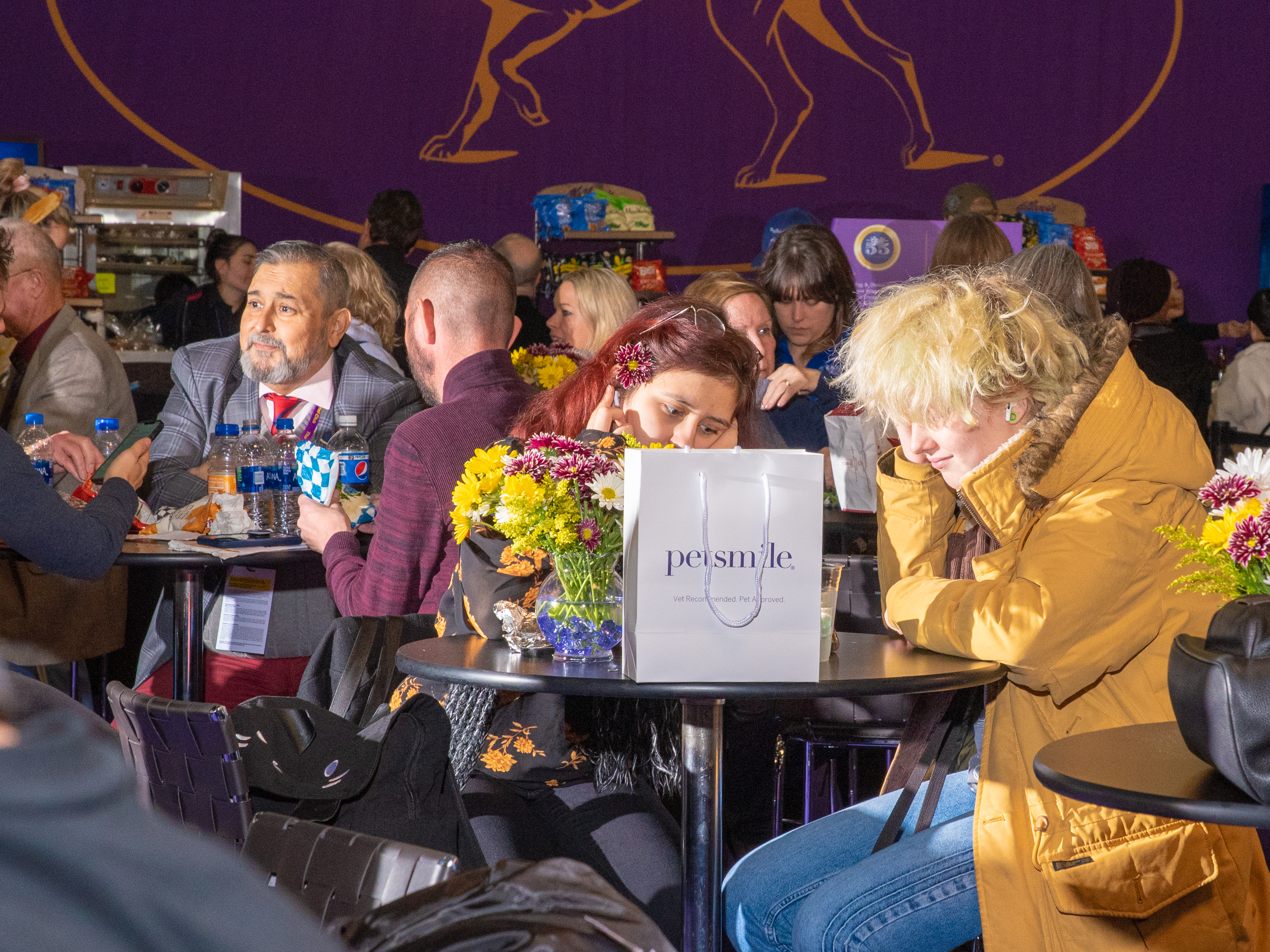 People hang out in the dining area at Pier 94 during the Westminster Dog Show (Evan Angelastro for TIME)