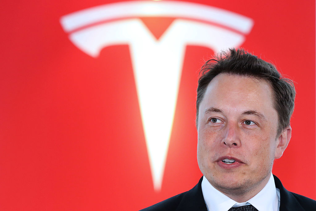 Elon Musk, co-founder and chief executive officer of Tesla Motors Inc., attends a key delivery ceremony of the company's premium electric sedan Model S vehicles to customers in Tokyo, Japan, on Sept. 8, 2014. (Yuriko Nakao––Bloomberg/Getty Images)