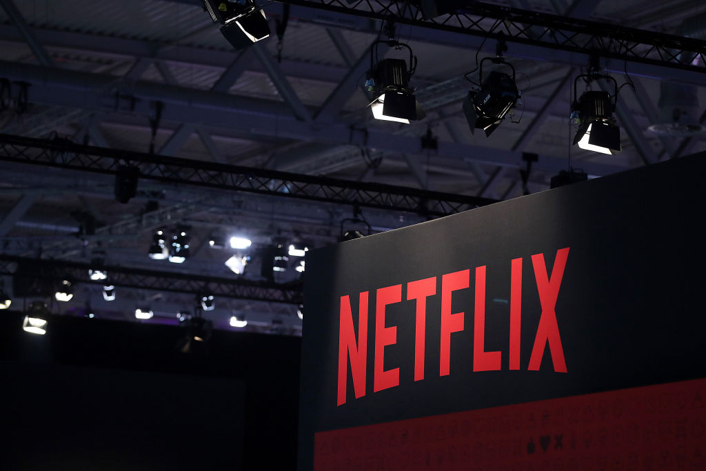 A Netflix Inc. logo sits on the online television streaming company's exhibition area at the Gamescom gaming industry event in Cologne, Germany, on Tuesday, Aug. 20, 2019. Gamescom is the world's largest gaming convention and runs from August 20 to 24. Photographer: Krisztian Bocsi/Bloomberg via Getty Images (Bloomberg via Getty Images&mdash;© 2019 Bloomberg Finance LP)