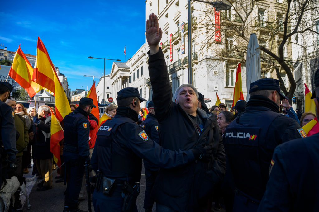 Far right wing supporter making a nazi salute protesting outside Spanish Parliament during the second vote of the investiture against the socialist candidate Pedro Sanchez for the presidency of the government in Madrid, Spain on Jan. 7, 2020. (LightRocket via Getty Images — 2020 Marcos del Mazo)
