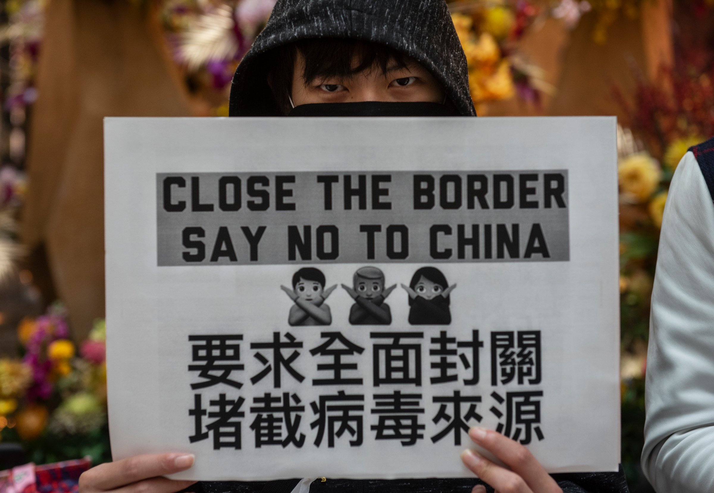 A demonstrator holds a placard during a protest calling on