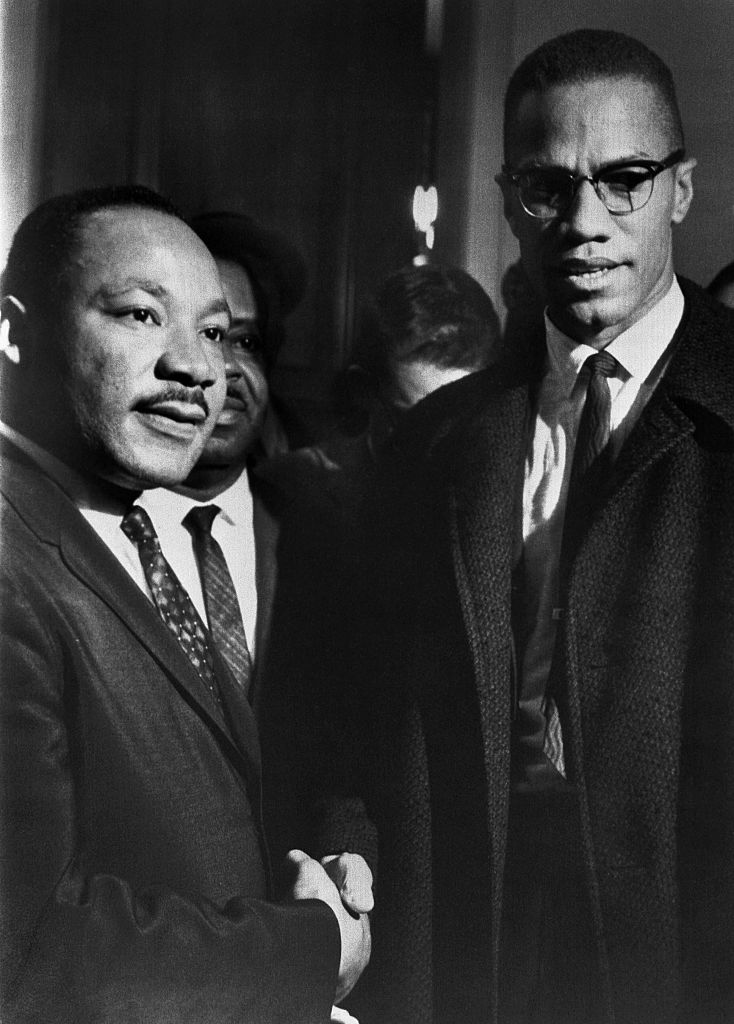 The brief, and only, meeting between Malcolm X and Martin Luther King, in the halls of the U.S. Capitol, observing a Senate filibuster on the Voting Rights Act. (Bettmann Archive)