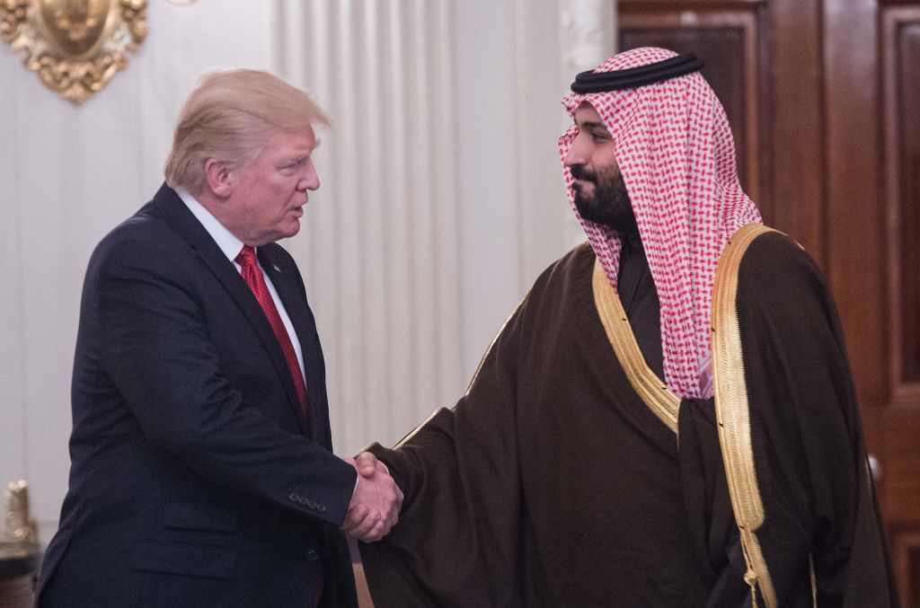 US President Donald Trump and Saudi Deputy Crown Prince and Defense Minister Mohammed bin Salman shake hands in the State Dining Room before lunch at the White House in Washington, DC, on March 14, 2017. (Nicholas Kamm—AFP/Getty Images)