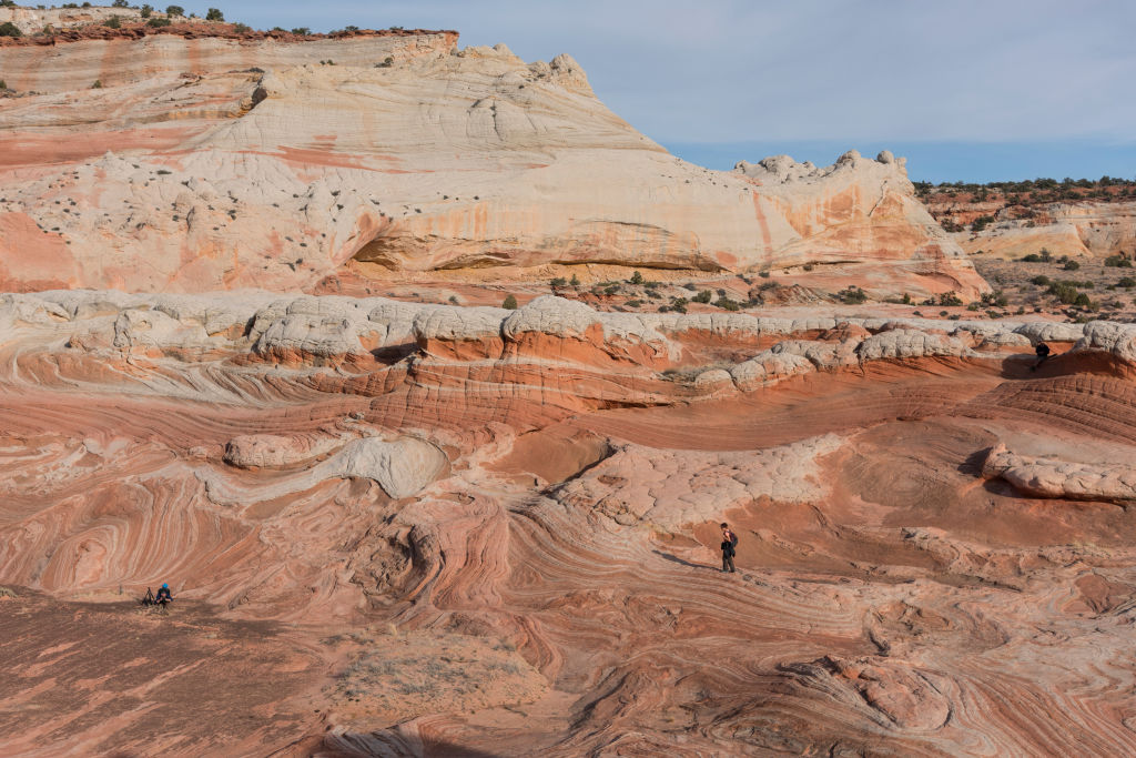 Woman hiking in sandstone landscape. (Universal Images Group via Getty)