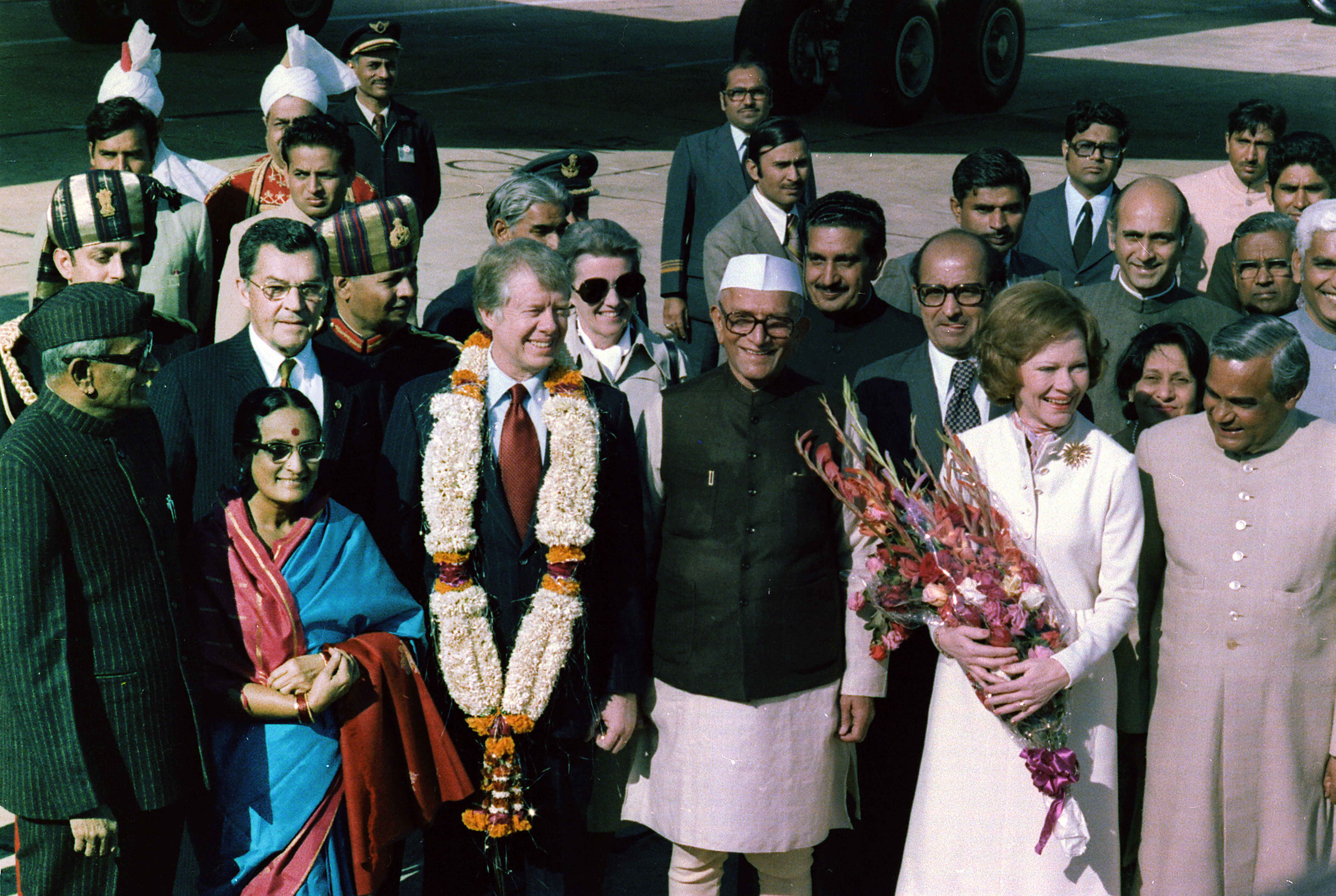 U.S. President Jimmy Carter is welcomed by Prime Minister Moraji Desai, standing with Rosalind Carter and future Indian Prime Minister Atal Bihari Vajpayee, during an arrival ceremony in New Delhi, India in January 1978.