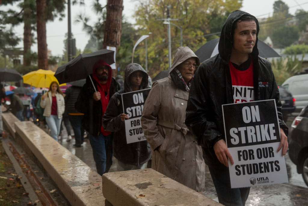 Teachers, students and supporters walk a picket line outside John Marshall High School in Los Angeles during a teachers strike spurred in part by public funding of charter schools, in January 2019.