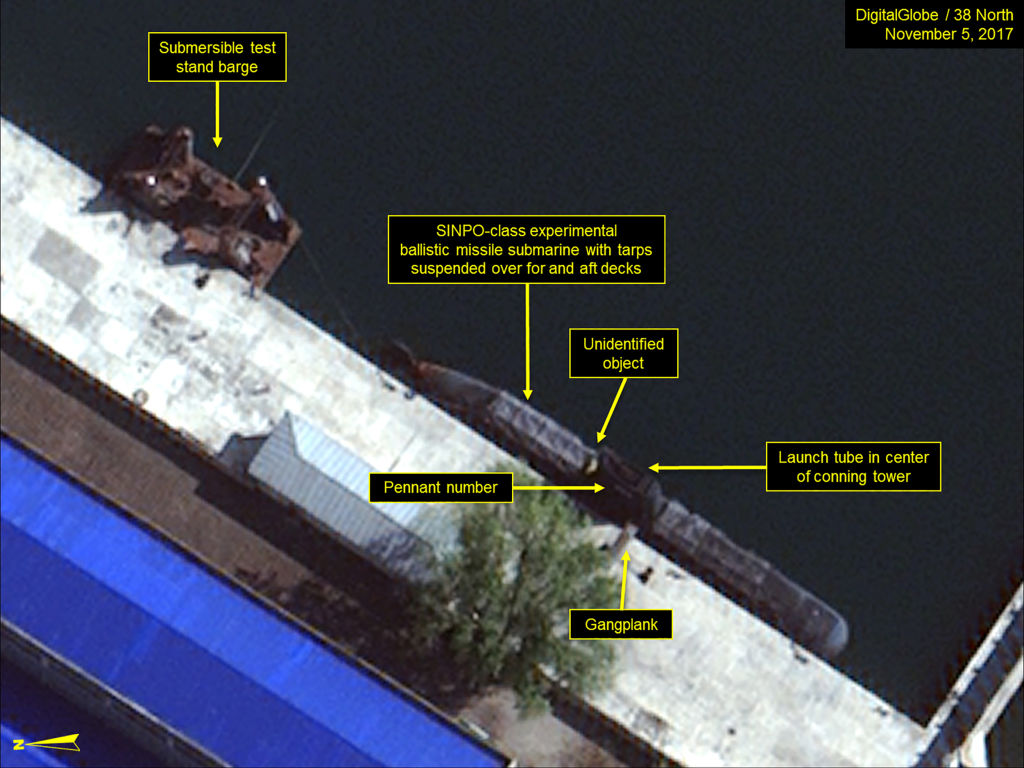 SINPO SOUTH SHIPYARD, NORTH KOREA - NOVEMBER 5, 2017:  Figure 4. SINPO-class submarine and submersible test stand barge berthed in the secure boat basin.