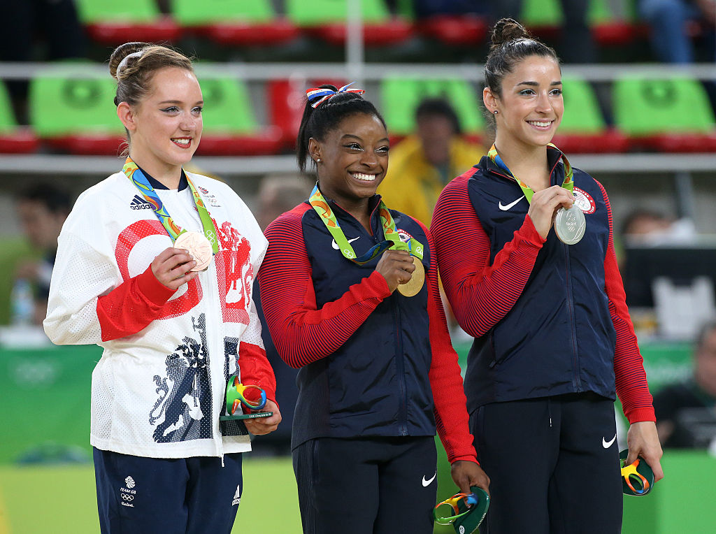 Bronze medalist Amy Tinkler of Great Britain, gold medalist Simone Biles of USA, silver medalist Alexandra Raisman of USA pose during the medal ceremony for the Women's Floor Exercise on day 11 of the Rio 2016 Olympic Games at Rio Olympic Arena on August 16, 2016 in Rio de Janeiro, Brazil. ((Getty Images—Jean Catuffe))