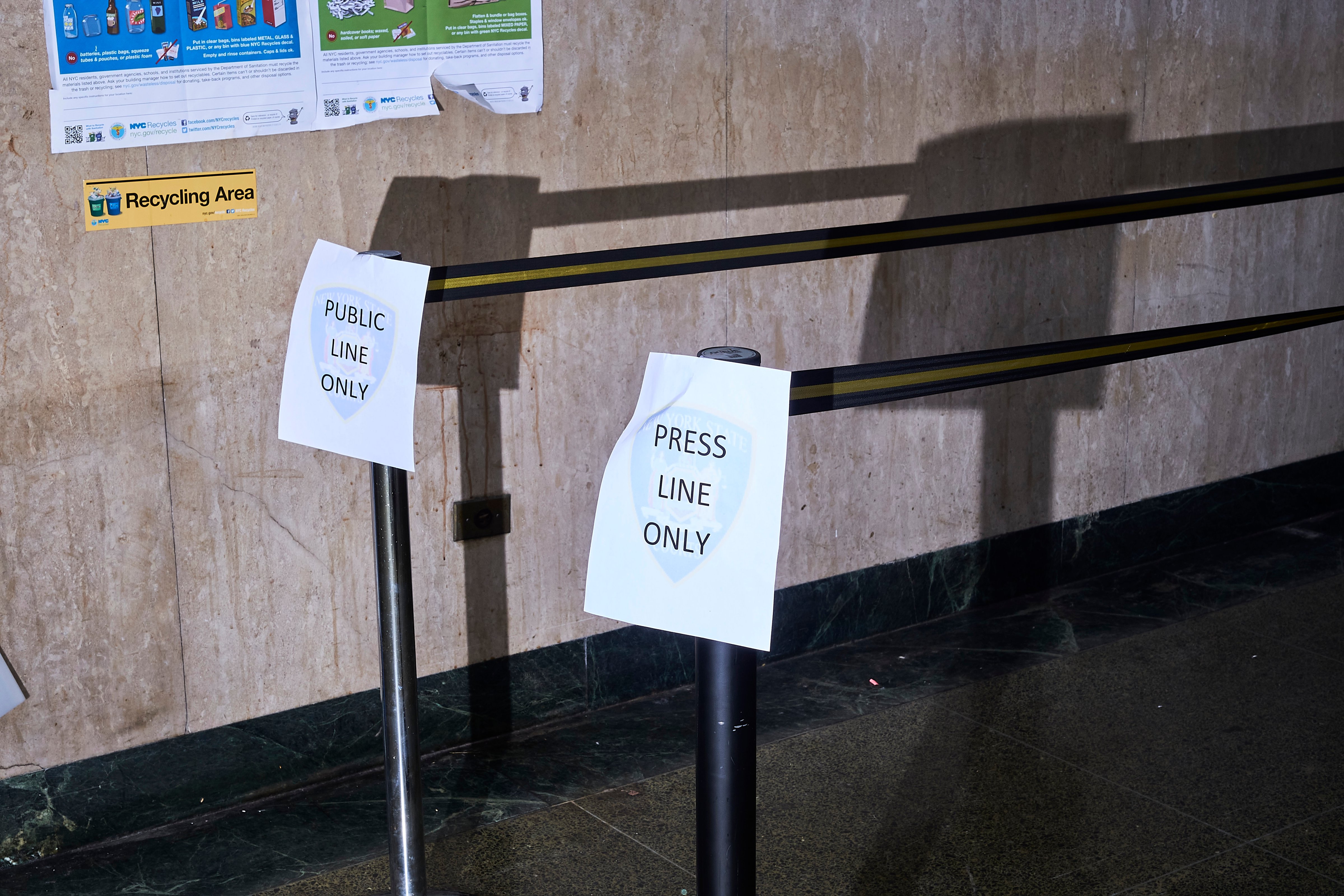 Signs in the New York City Criminal Court hallway designate public and press lines on Jan. 8 (John Taggart—Redux)