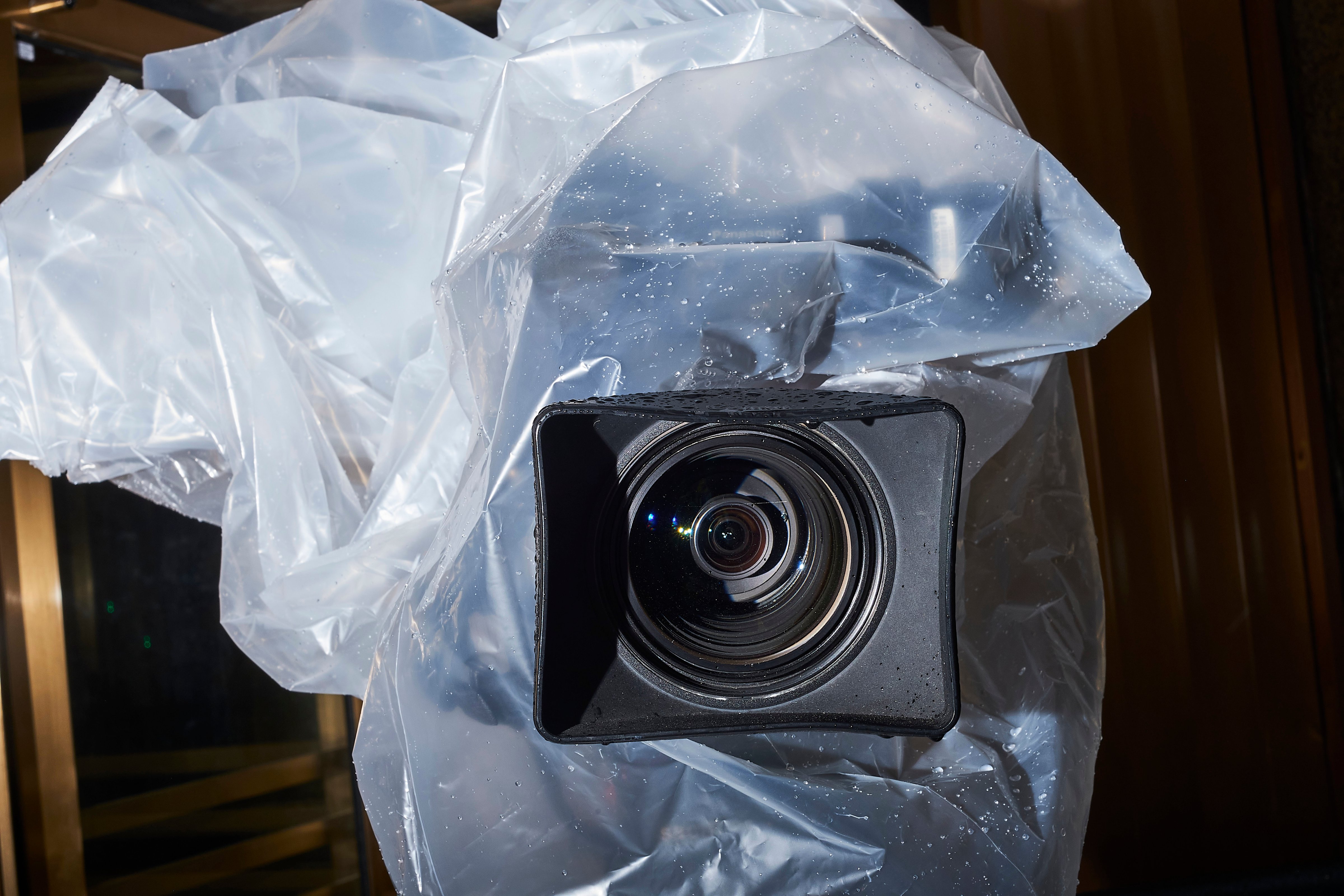 A television camera is protected from rain outside the New York City Criminal Court, Jan. 16 (John Taggart)