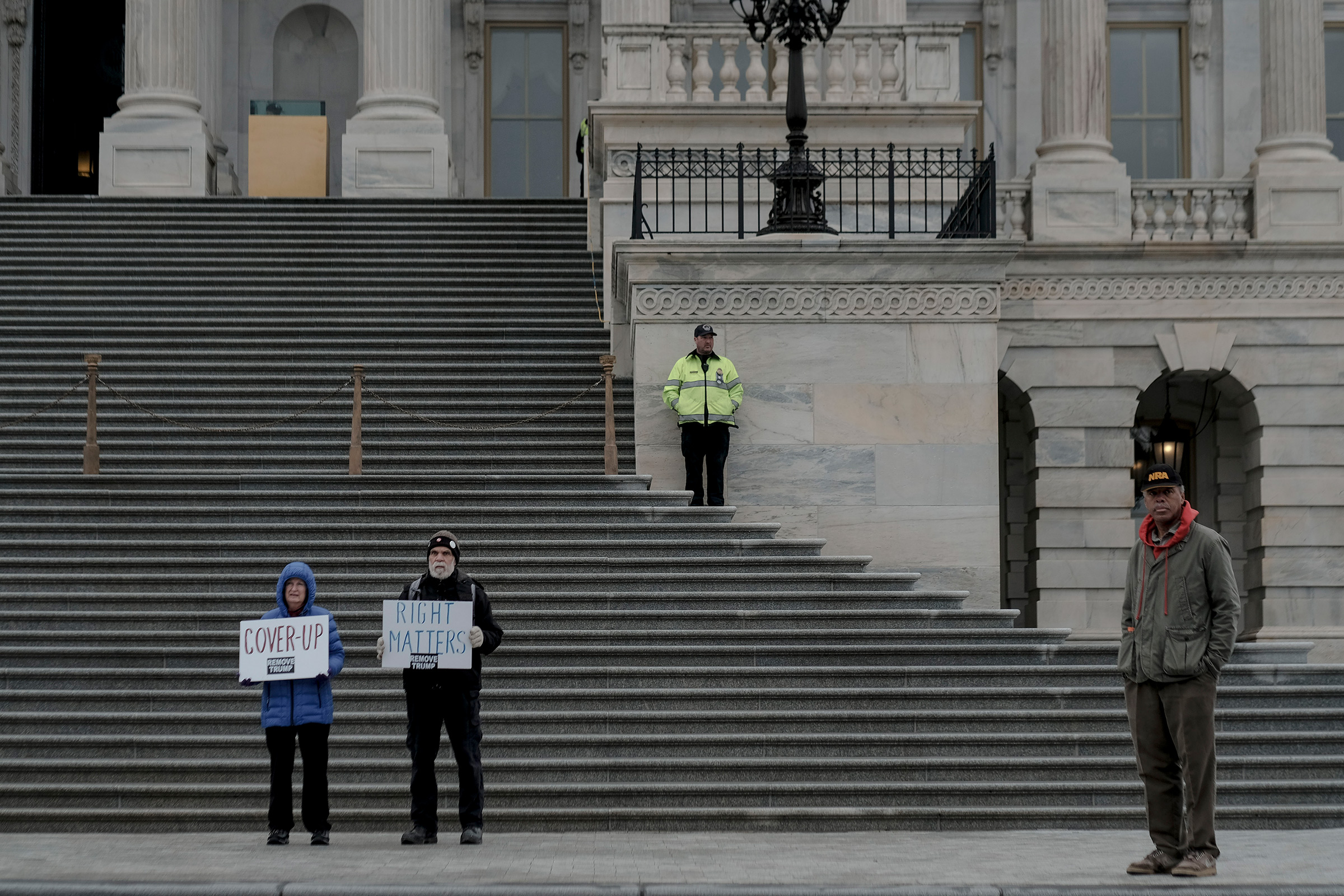 A few protestors demonstrate outside the senate chamber during the impeachment trial Saturday morning in Washington, D.C., on Jan. 25, 2020. (Gabriella Demczuk for TIME)