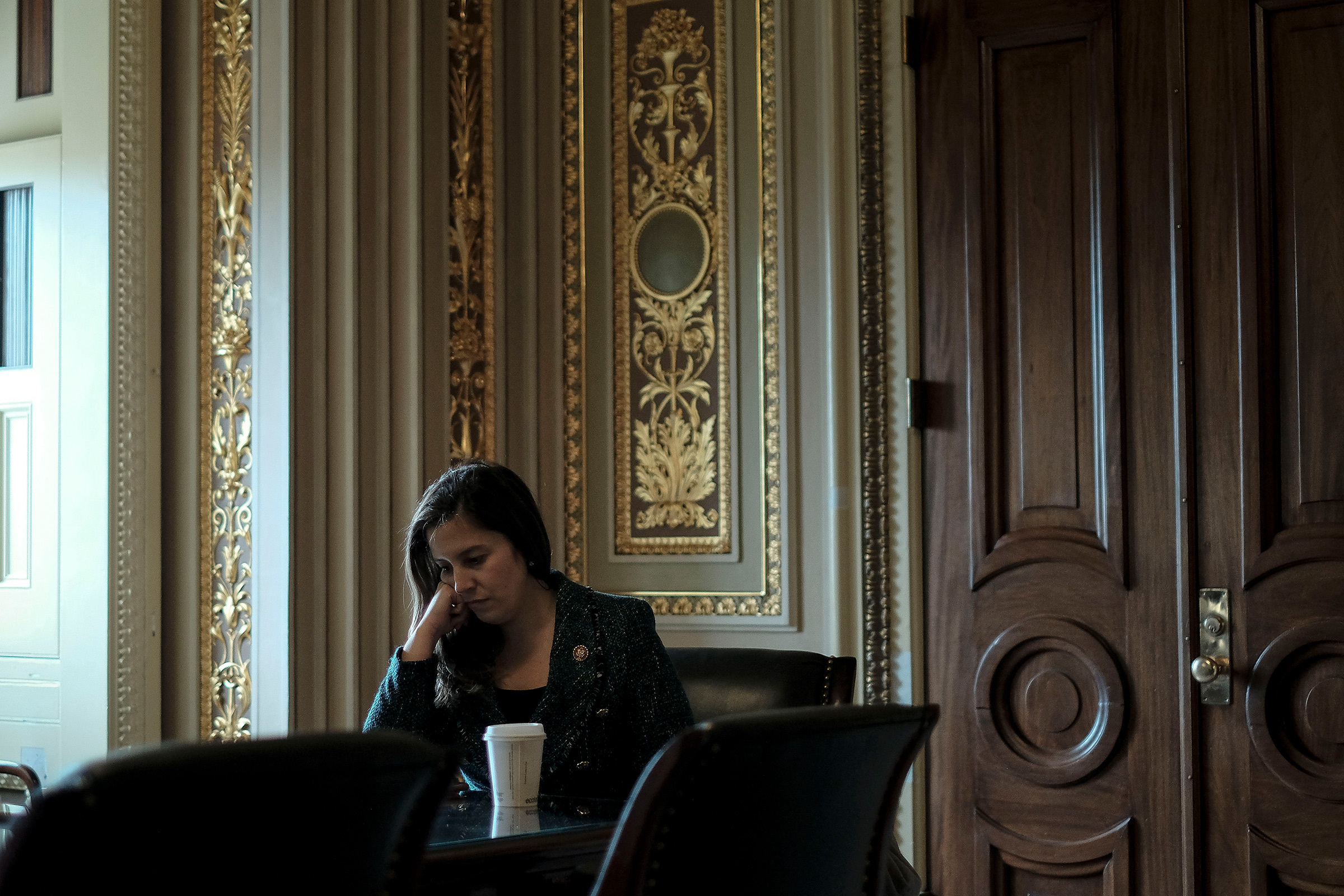 Rep. Elise Stefanik (R-N.Y.), an advisor to Trump's defense team, sits with her staffers outside the defense team meeting room before the impeachment trial at the Capitol in Washington, D.C., on Jan. 24, 2020. (Gabriella Demczuk for TIME)