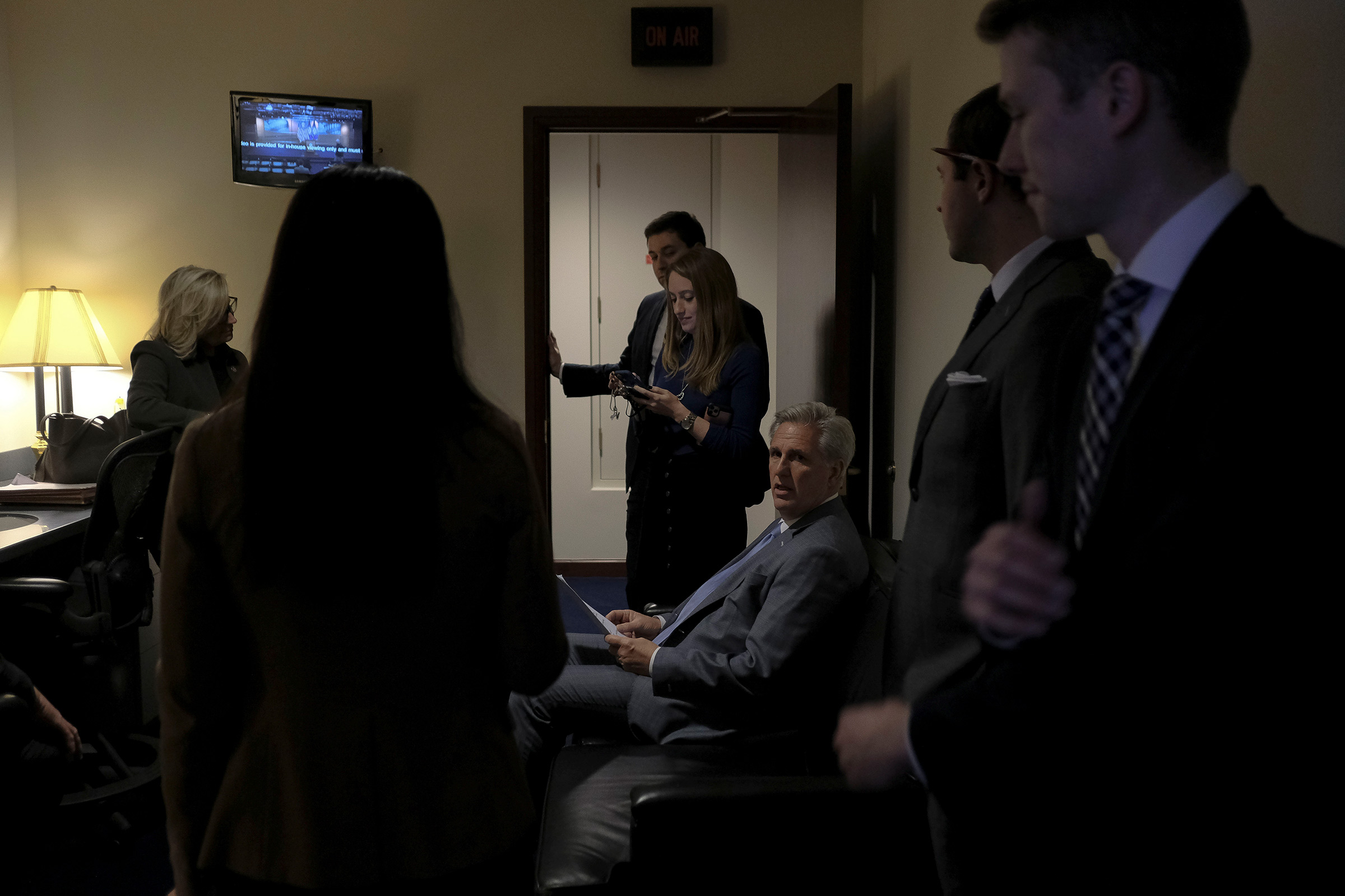 House Minority Leader Kevin McCarthy (R-Calif.) reads over his notes with other GOP leaders before a press conference denouncing the vote on the articles of impeachment at the Capitol in Washington, D.C., on Dec. 17, 2019. (Gabriella Demczuk for TIME)